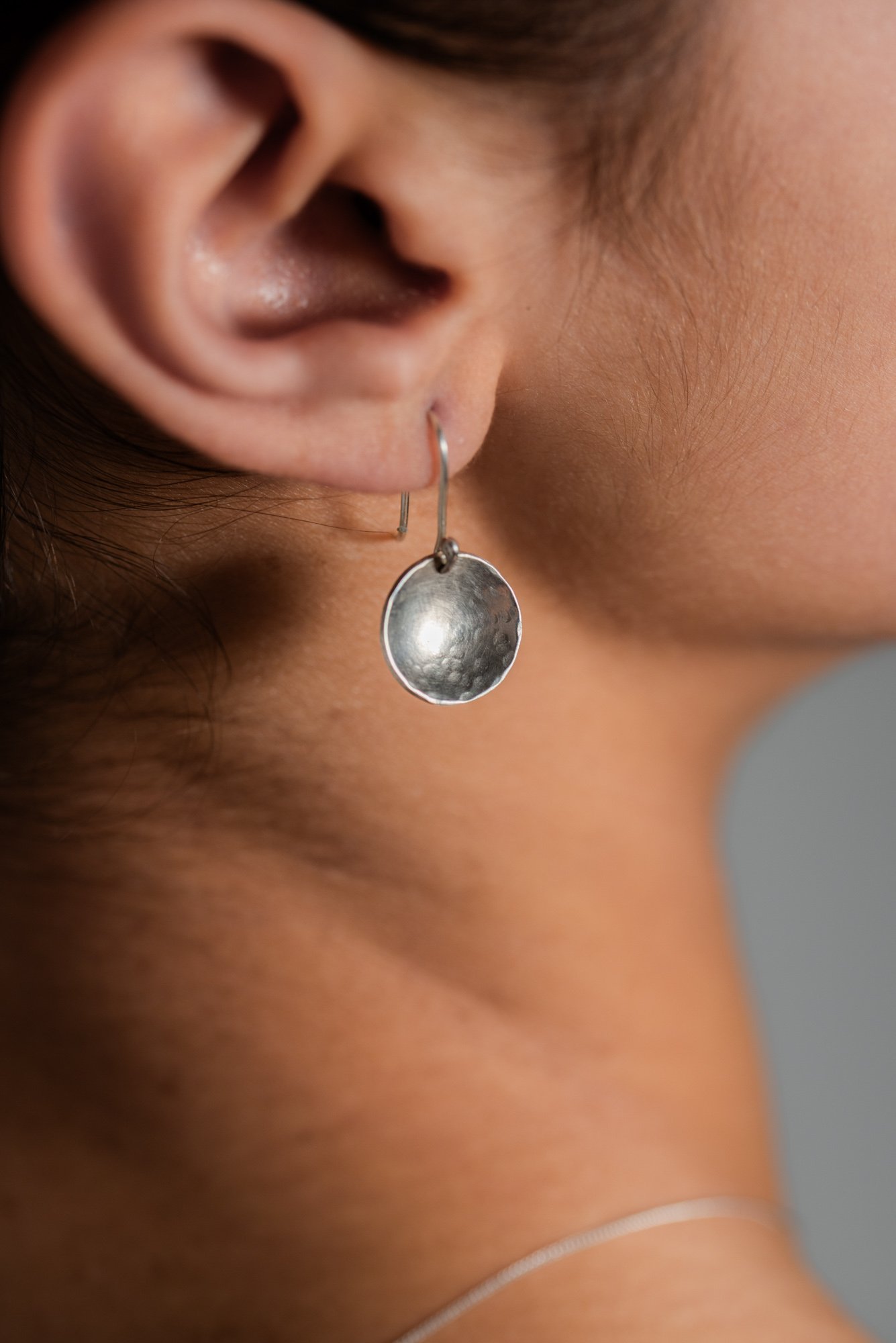 Silver "Aurora" earrings, hammer-textured domed discs