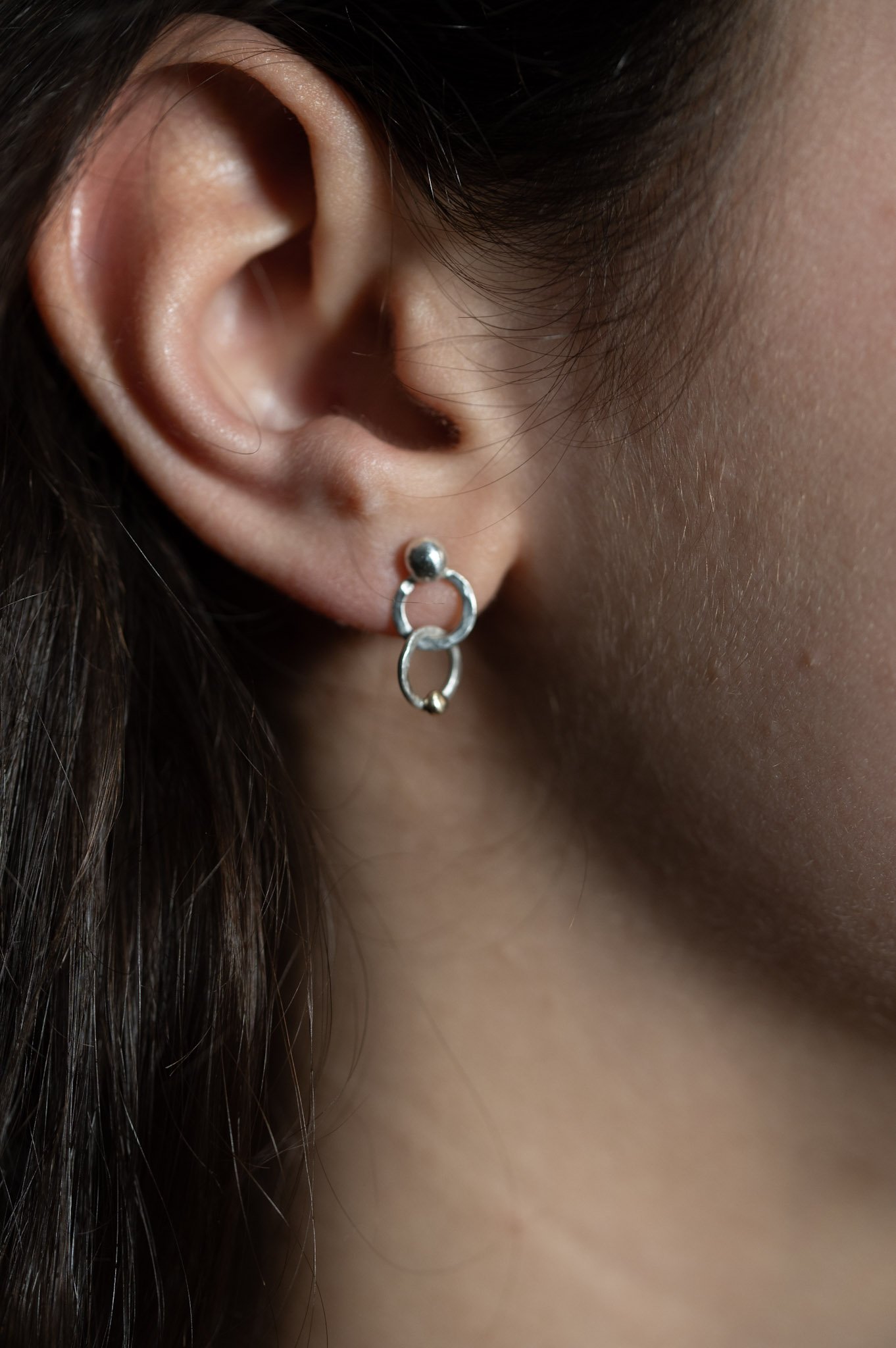 Silver "Minerva" stud earrings, hammer-textured interlinked hoops with gold detail