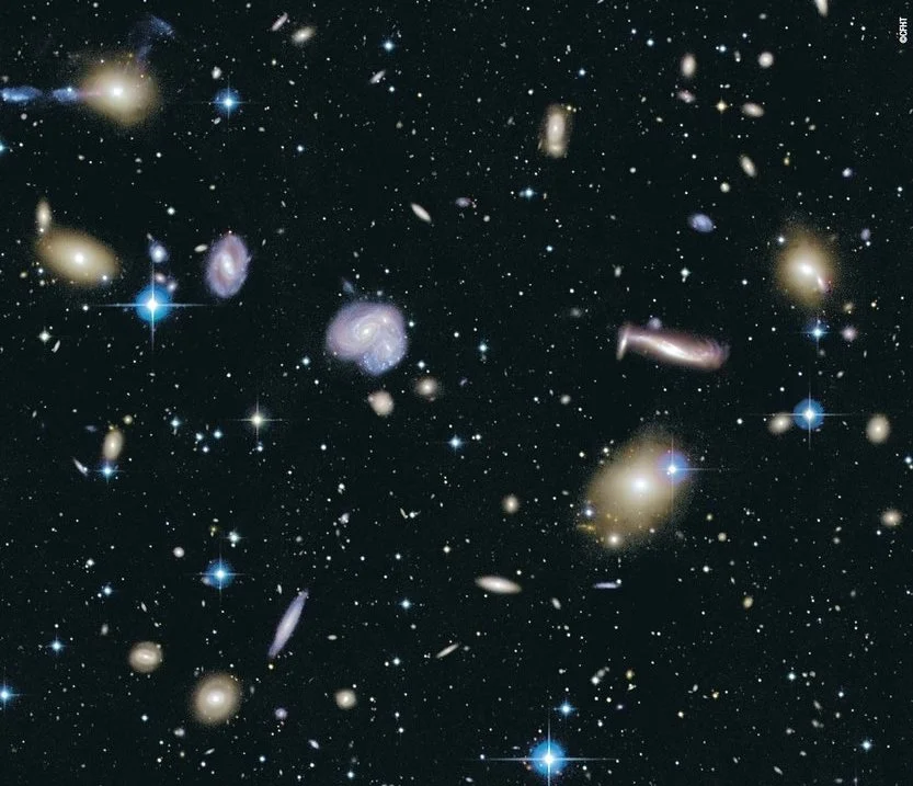 A cluster of distant galaxies (Canada France Hawaii Telescope image, courtesy NRC/CFHT)