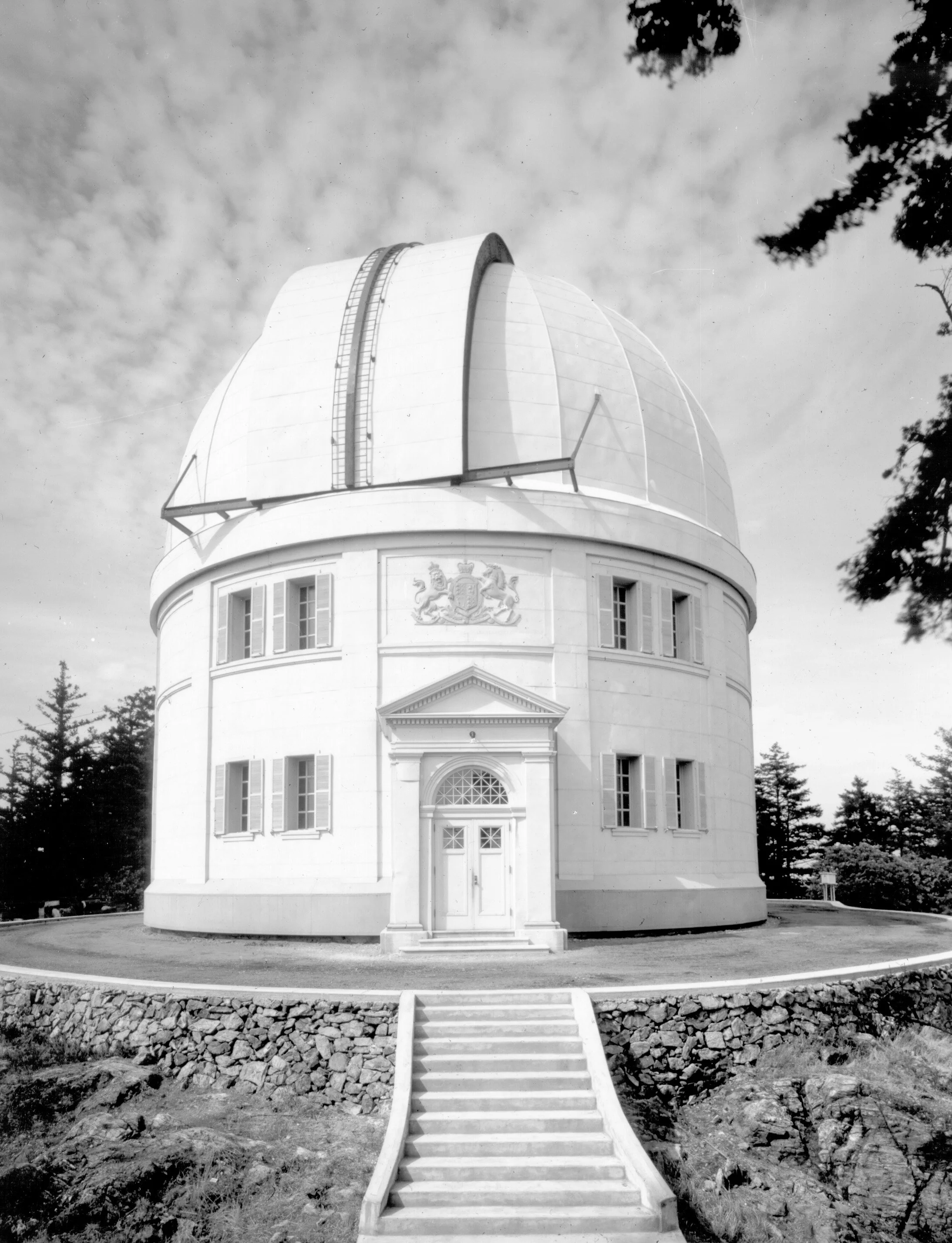 Dome complete with shutters rotated and closed; elevated view from south clearly showing entire dome, front entrance and steps