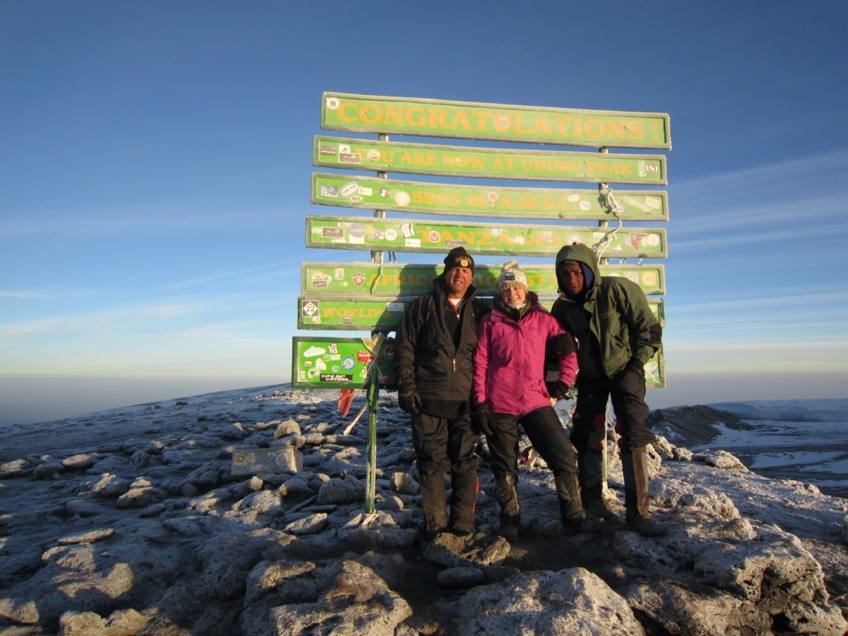 Gordon MacLeod at Uhuru peak in 2012 (with daughter and guide).