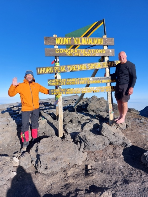 Gordon MacLeod at Uhuru peak in 2022 (with Shep Doelman).