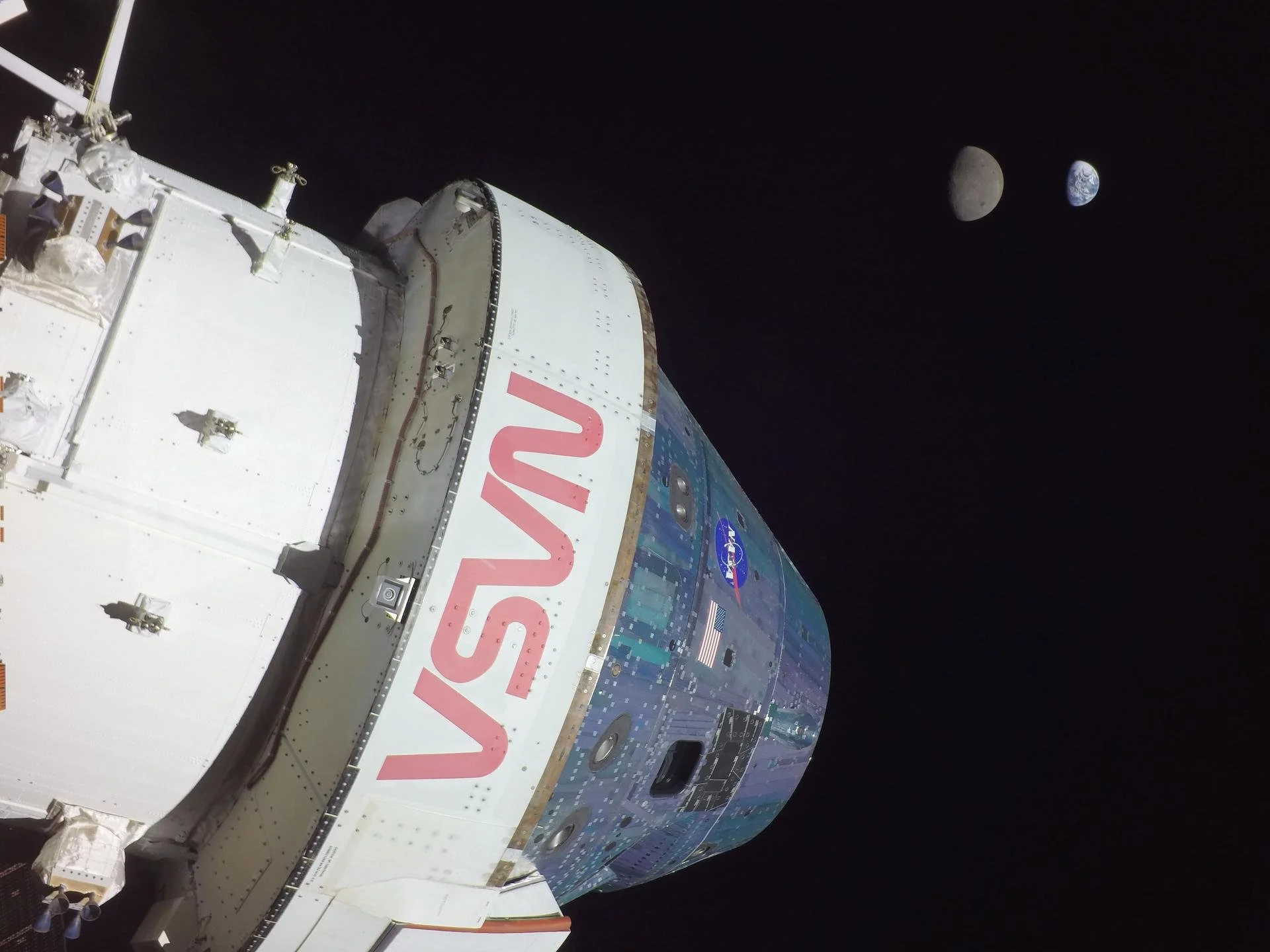Close-up of the SpaceX Dragon spacecraft with Earth, the Moon, and space in the background.