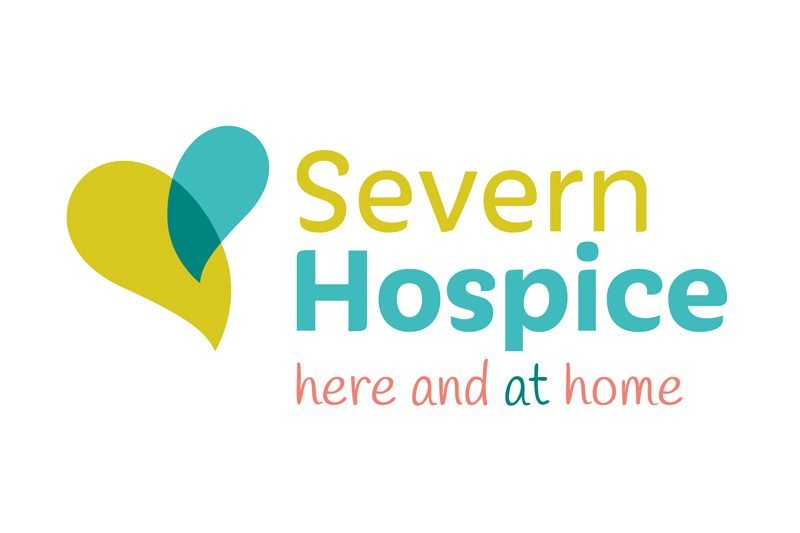 Logo of Severn Hospice with a stylized heart design and the text "Severn Hospice" and "here and at home" underneath