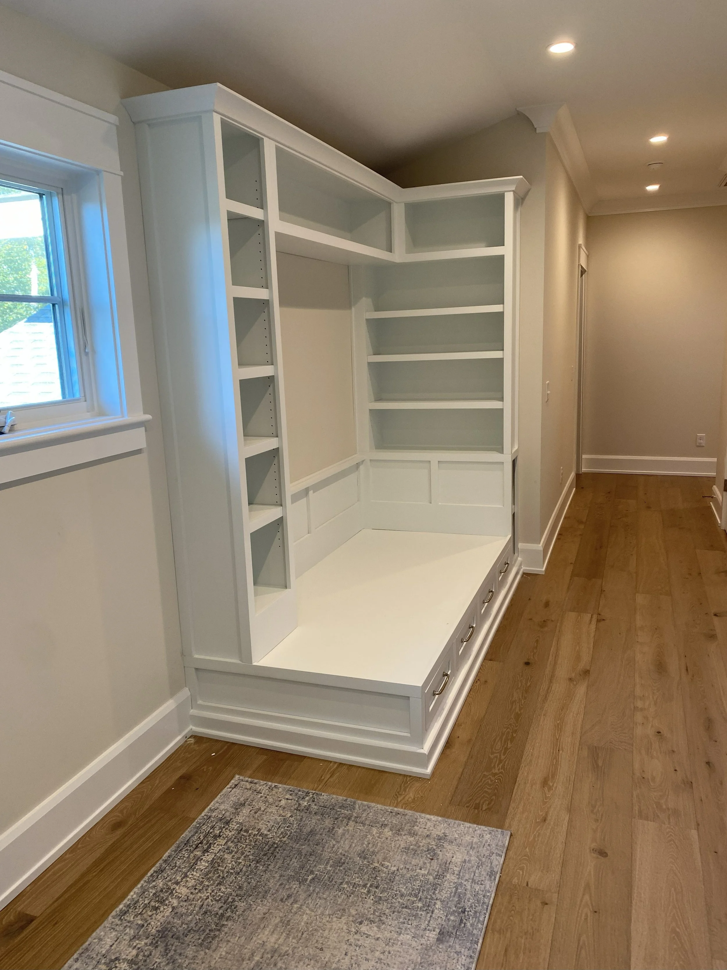 Custom built-in day bed with bookcases.