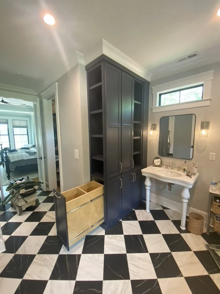 Custom bathroom built-in with laundry storage
