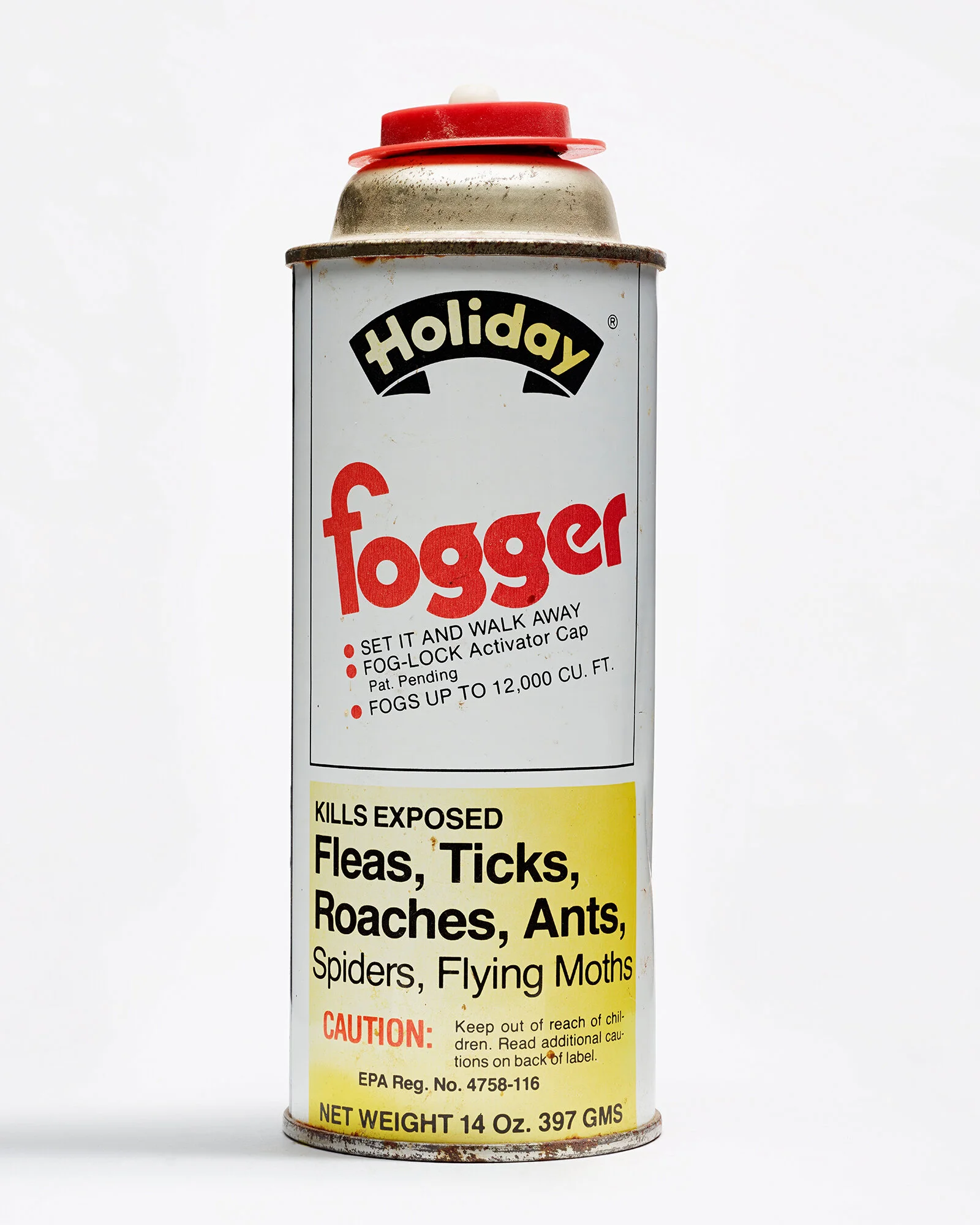 A can of Holiday Fogger insecticide with a warning label for killing fleas, ticks, roaches, ants, spiders, and flying moths.