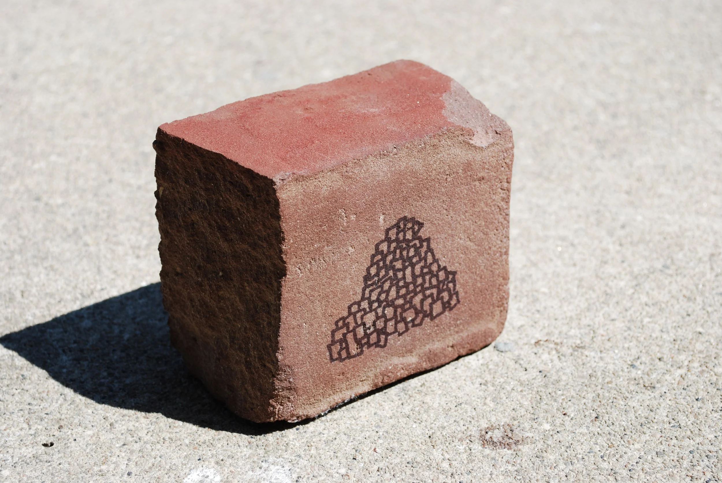 Untitled, 3 x 3 x 2 inches, Sharpie on brick, 2009 - Confiscated by TSA