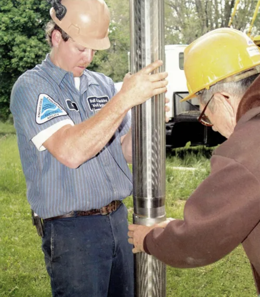 Rod E Jenkins and his grandfather preparing a well for Hall and Jenkins Well Drilling. Water Well inspection services now being offered through Aquawell Inspection Services.