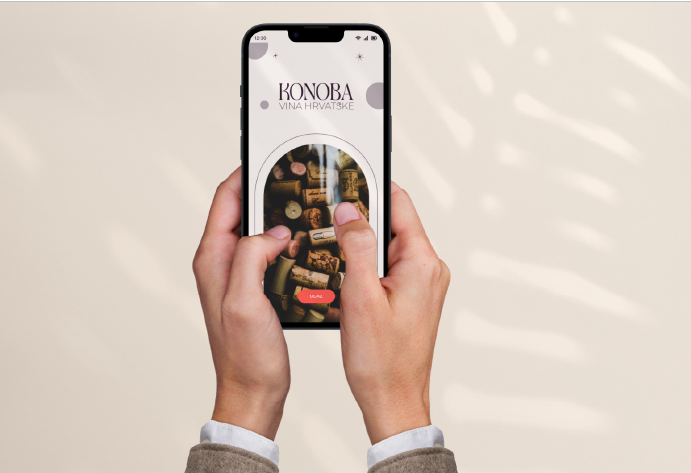 Person holding a smartphone with a wine-related app displaying corks and wine bottles, with background light and shadows.