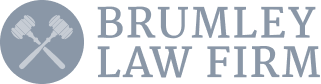 Logo of Brumley Law Firm with two crossed hammers inside a circle