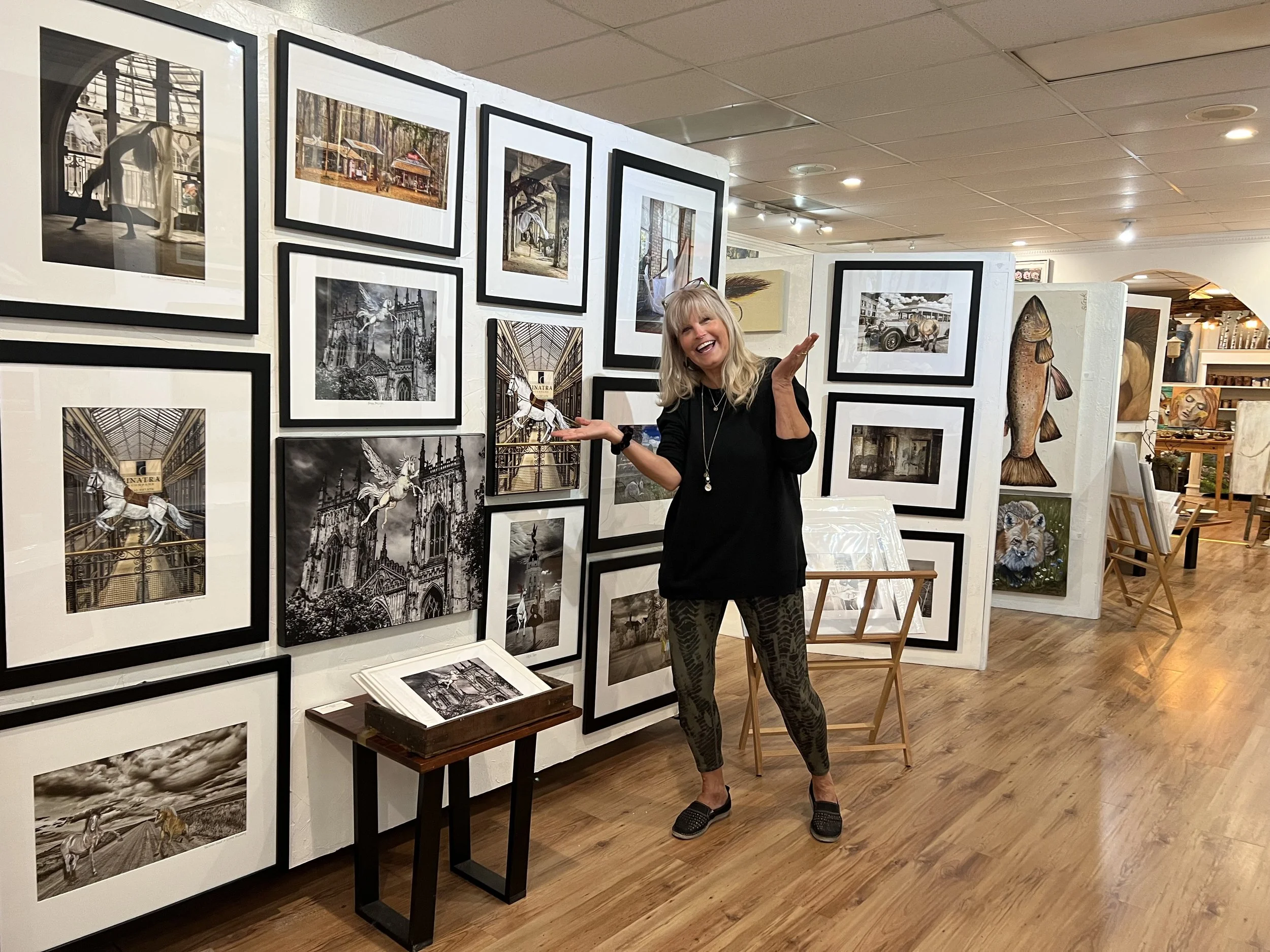 Jaye Mullins, mixed media artist, in local art gallery