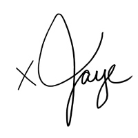 Black background with faint, abstract white lines or scribbles.