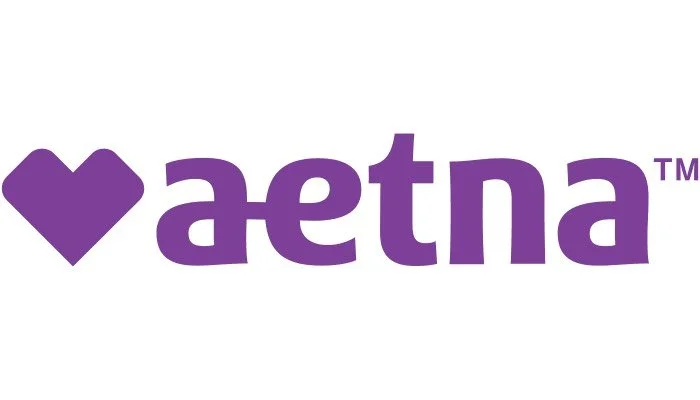 The Aetna logo with a purple heart symbol to the left of the name 'Aetna' in purple text.
