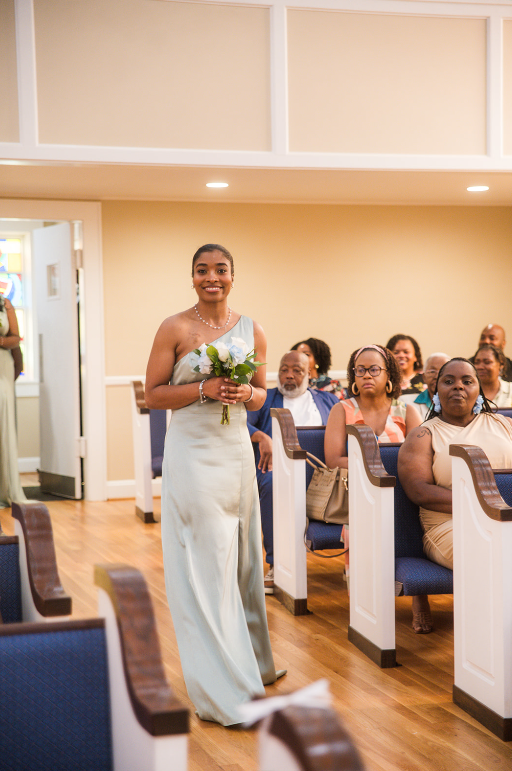 bridesmaids down aisle.png