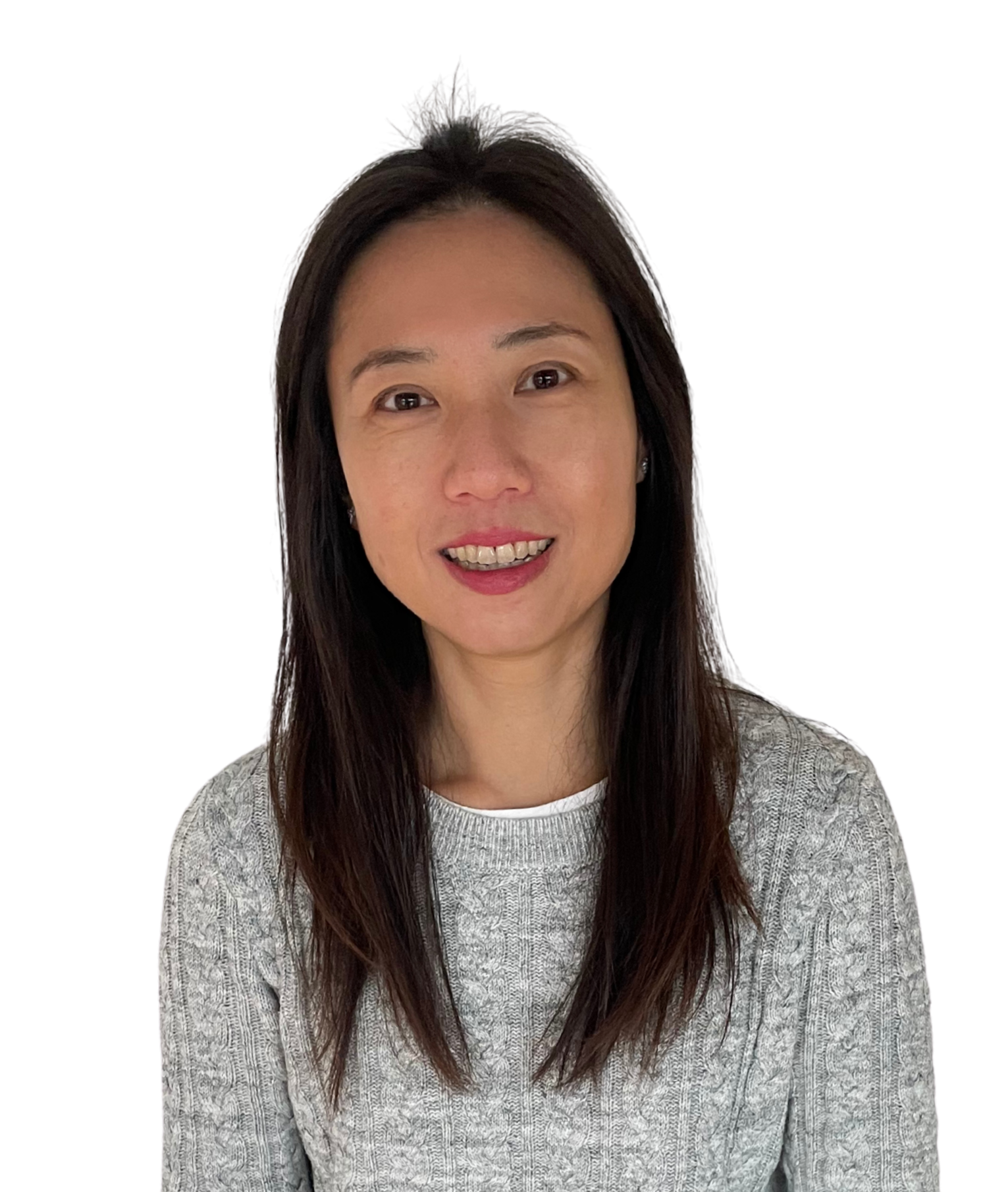 A woman with long dark hair, wearing a gray sweater, smiling at the camera.