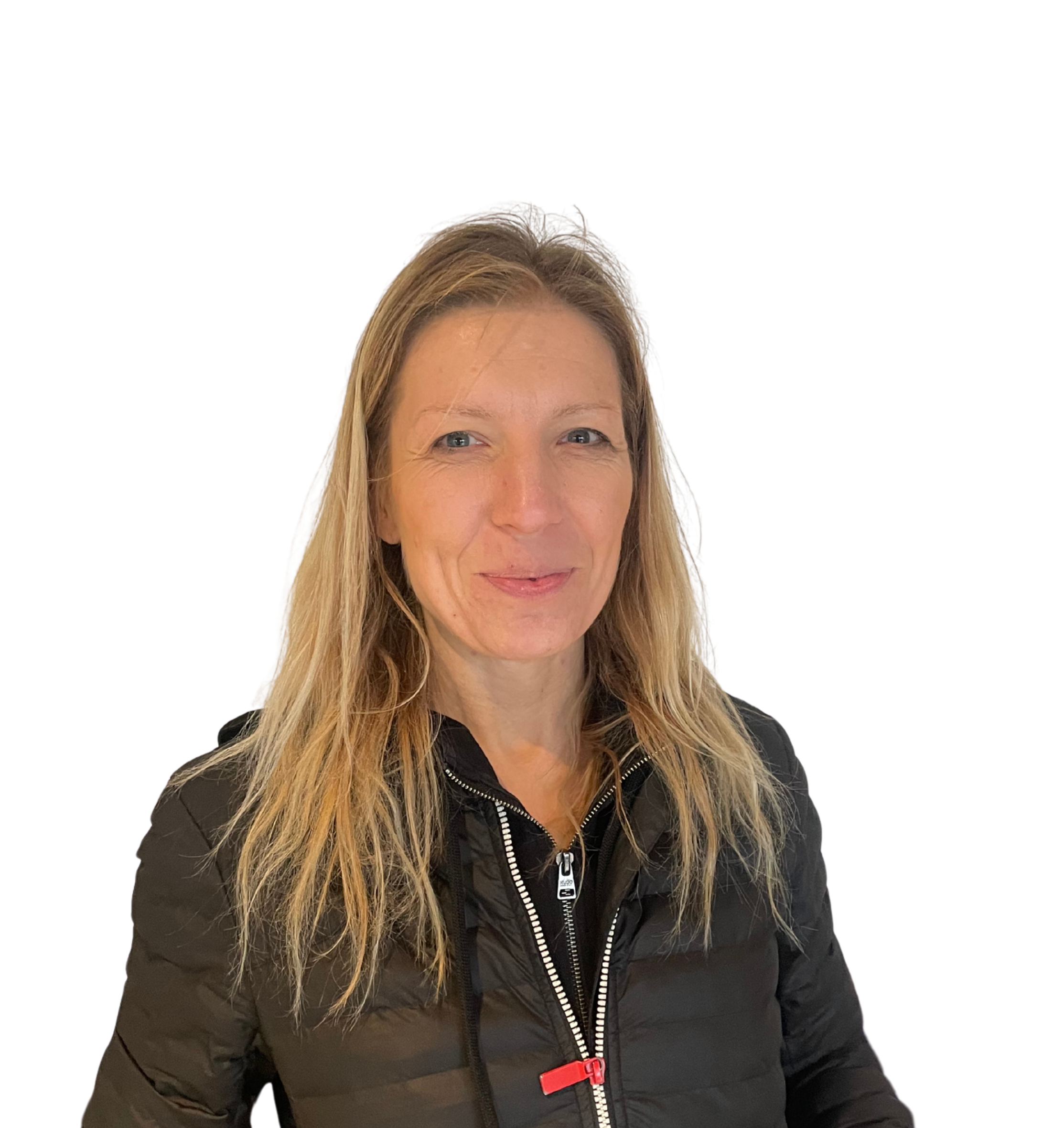 A woman with long blonde hair wearing a black jacket, smiling slightly against a black background.