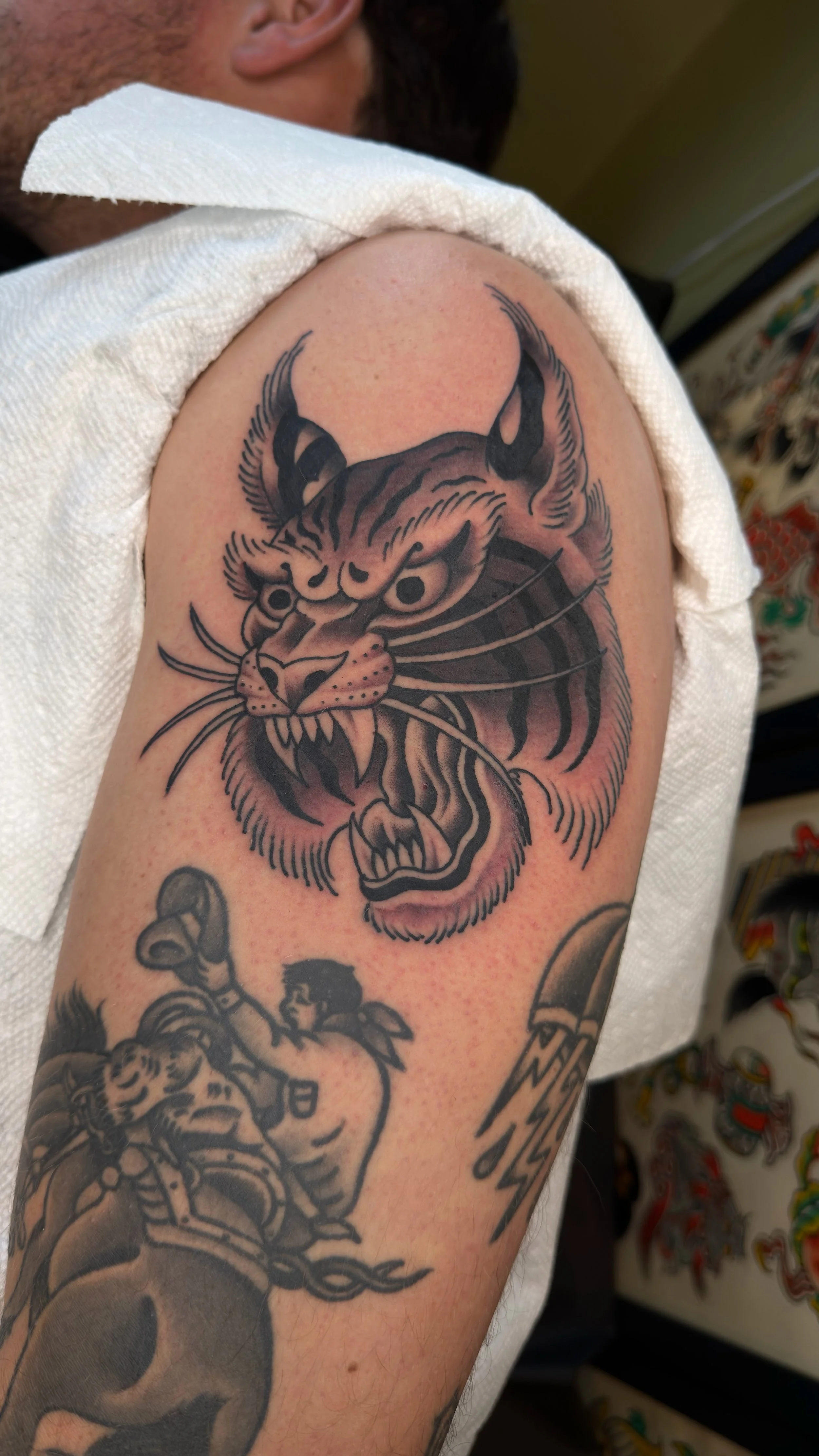 Landon Eck Traditional Japanese Tiger Tattoo on the upper arm at Dame of the West Tattoo in Scottsdale, Arizona