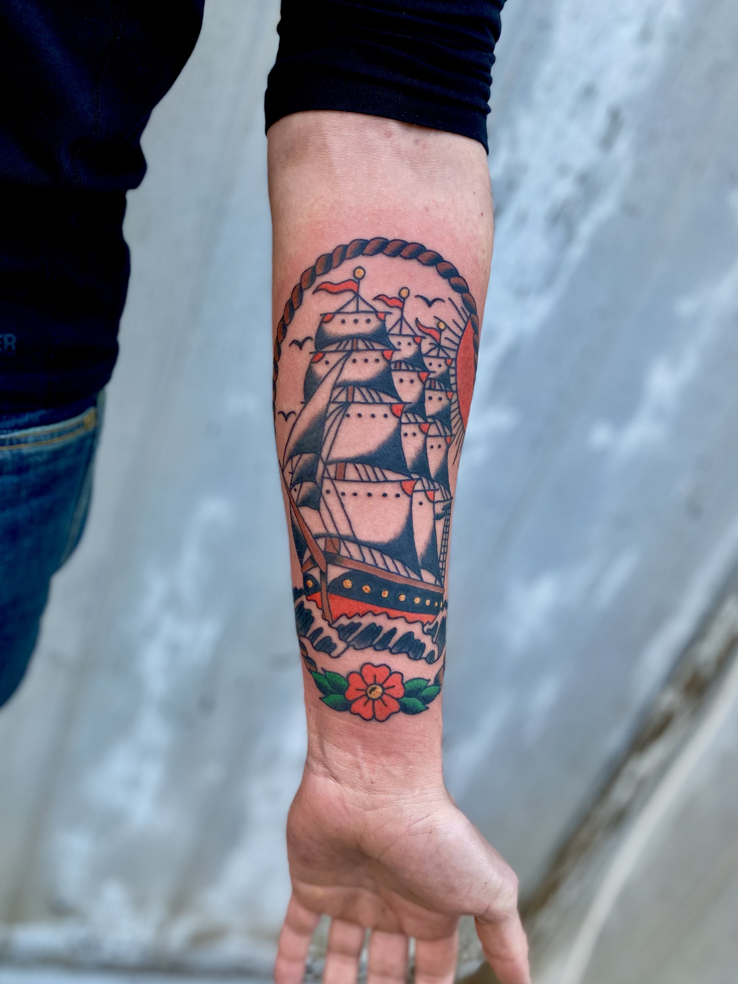 Jonas Richards, @jonasrichardstattoo American Traditional Clipper Ship Tattoo on the forearm. Done at Dame of the West Tattoo in Scottsdale, Arizona.