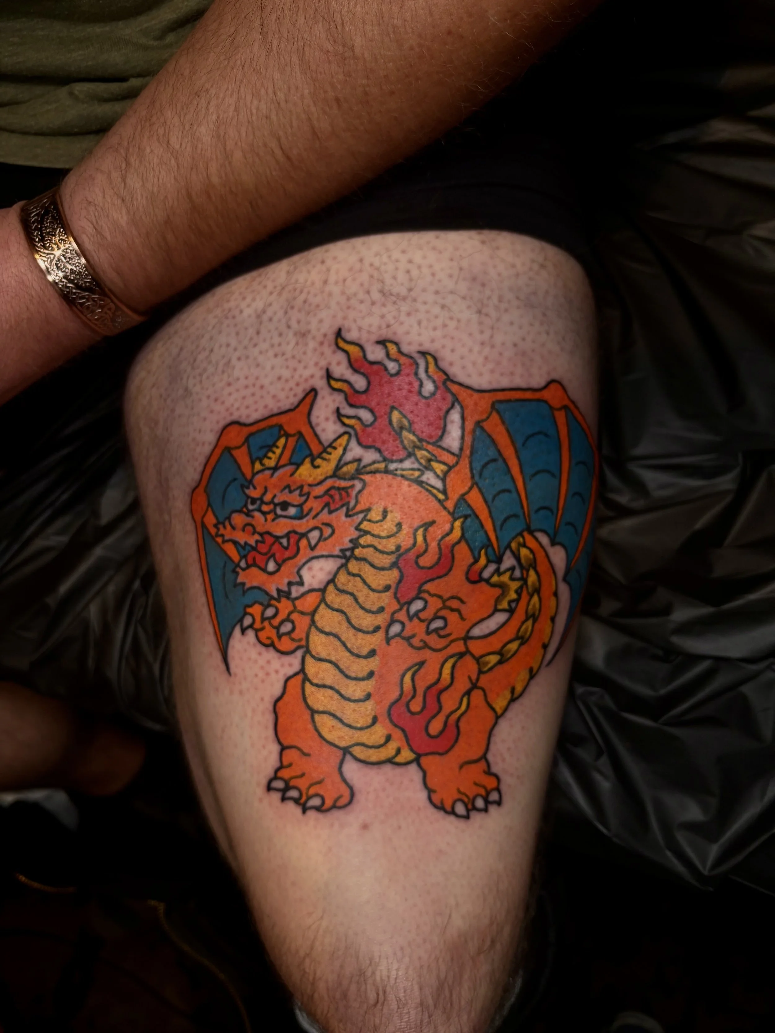 Jonas Richards, @jonasrichardstattoo Traditional Japanese Style Pokémon Charizard Tattoo on the thigh done at Dame of the West Tattoo in Scottsdale, Arizona.