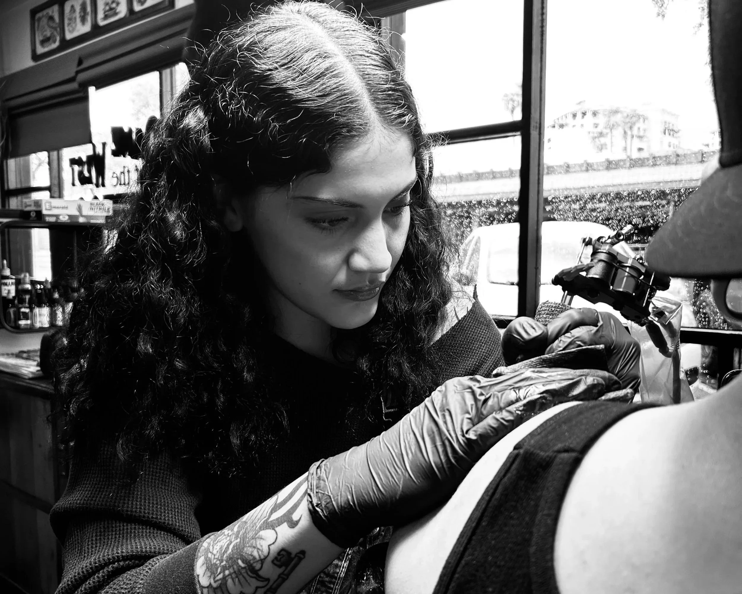A client of Dame of the West Tattoo located in the heart of Old Town Scottsdale, Arizona is getting a tattoo on their arm by professional tattoo artist, Mel Gonzalez.