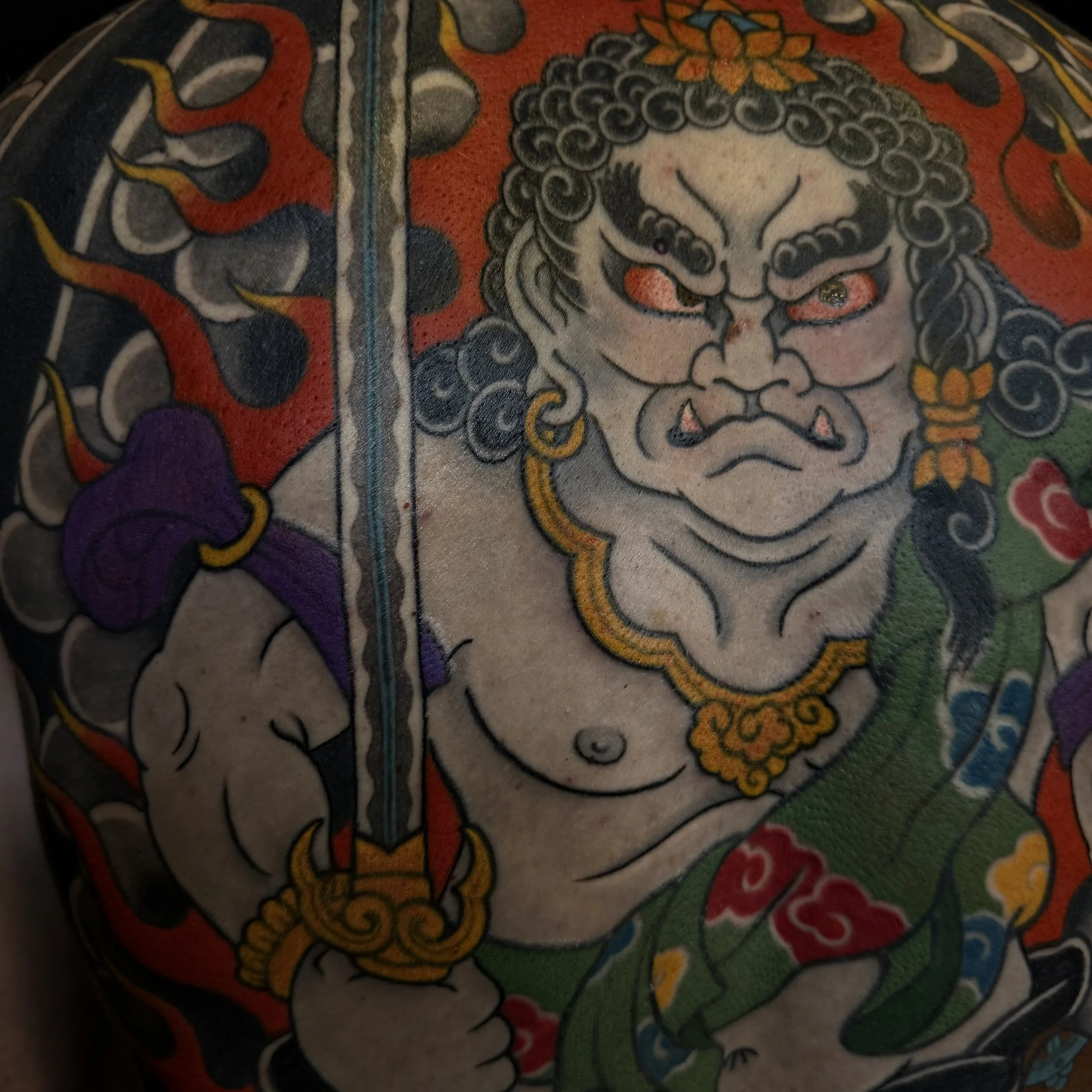 Japanese back piece of Fudō Myōō with flames and two attendants