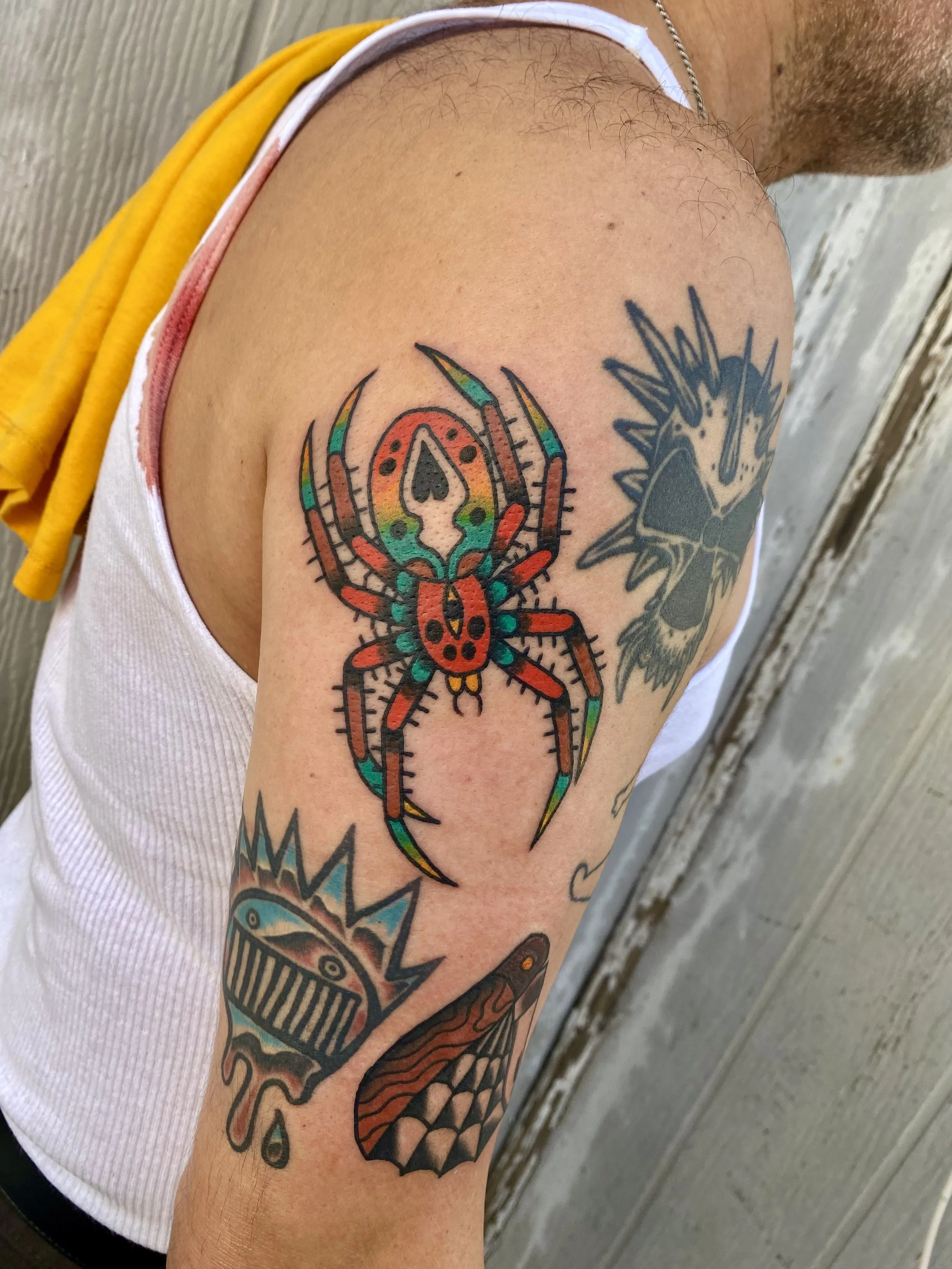 Jonas Richards, @jonasrichardstattoo Traditional Style Spider Tattoo on the upper arm done at Dame of the West Tattoo in Scottsdale, Arizona,