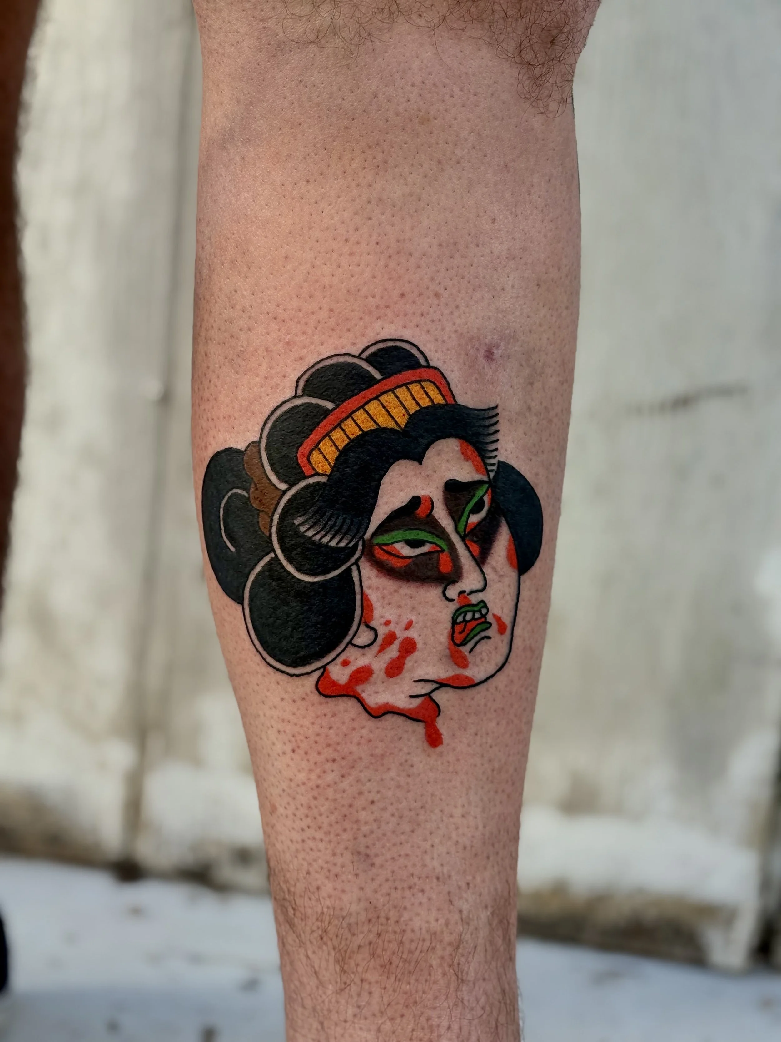 Jonas Richards, @jonasrichardstattoo Traditional Japanese Severed Lady Head Tattoo on the calf done at Dame of the West Tattoo in Scottsdale, Arizona.