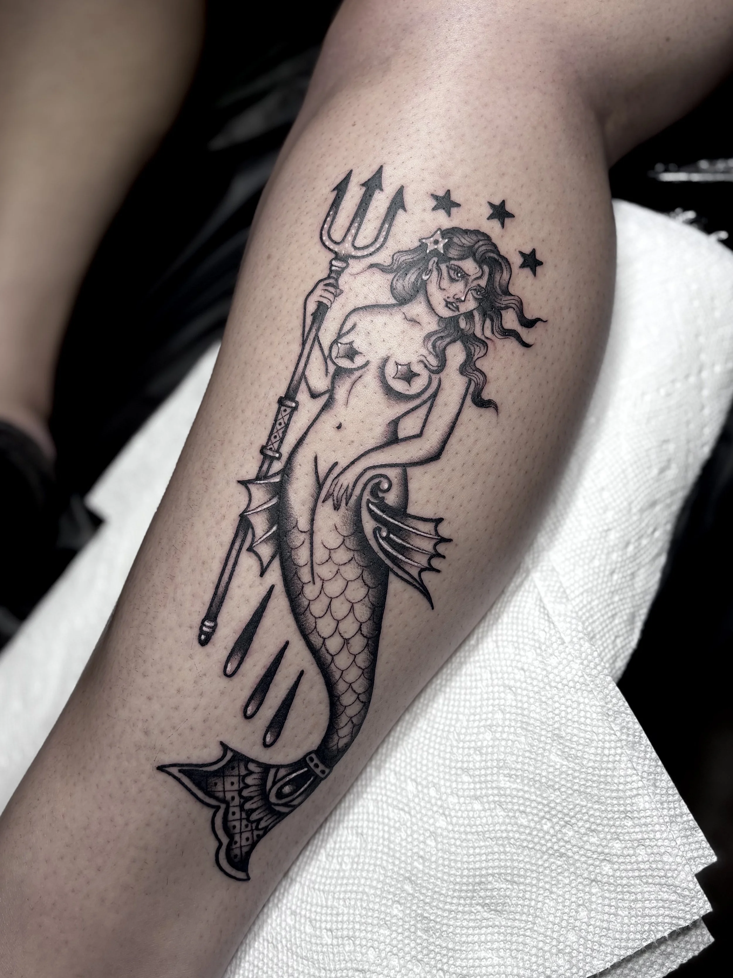 Suzie Q, @suzieqtattoos Traditional style Mermaid tattoo on the leg at Dame of the West Tattoo in Scottsdale, Arizona