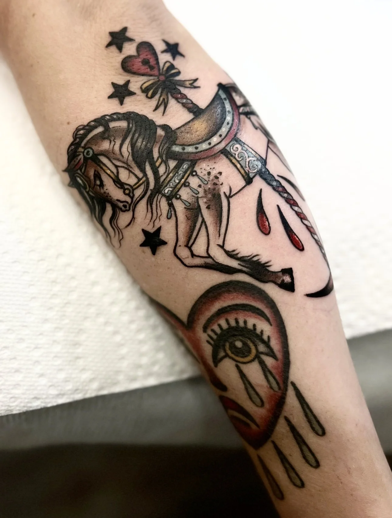 Suzie Q, @suzieqtattoos Traditional style Carousel tattoo on the leg at Dame of the West Tattoo in Scottsdale, Arizona