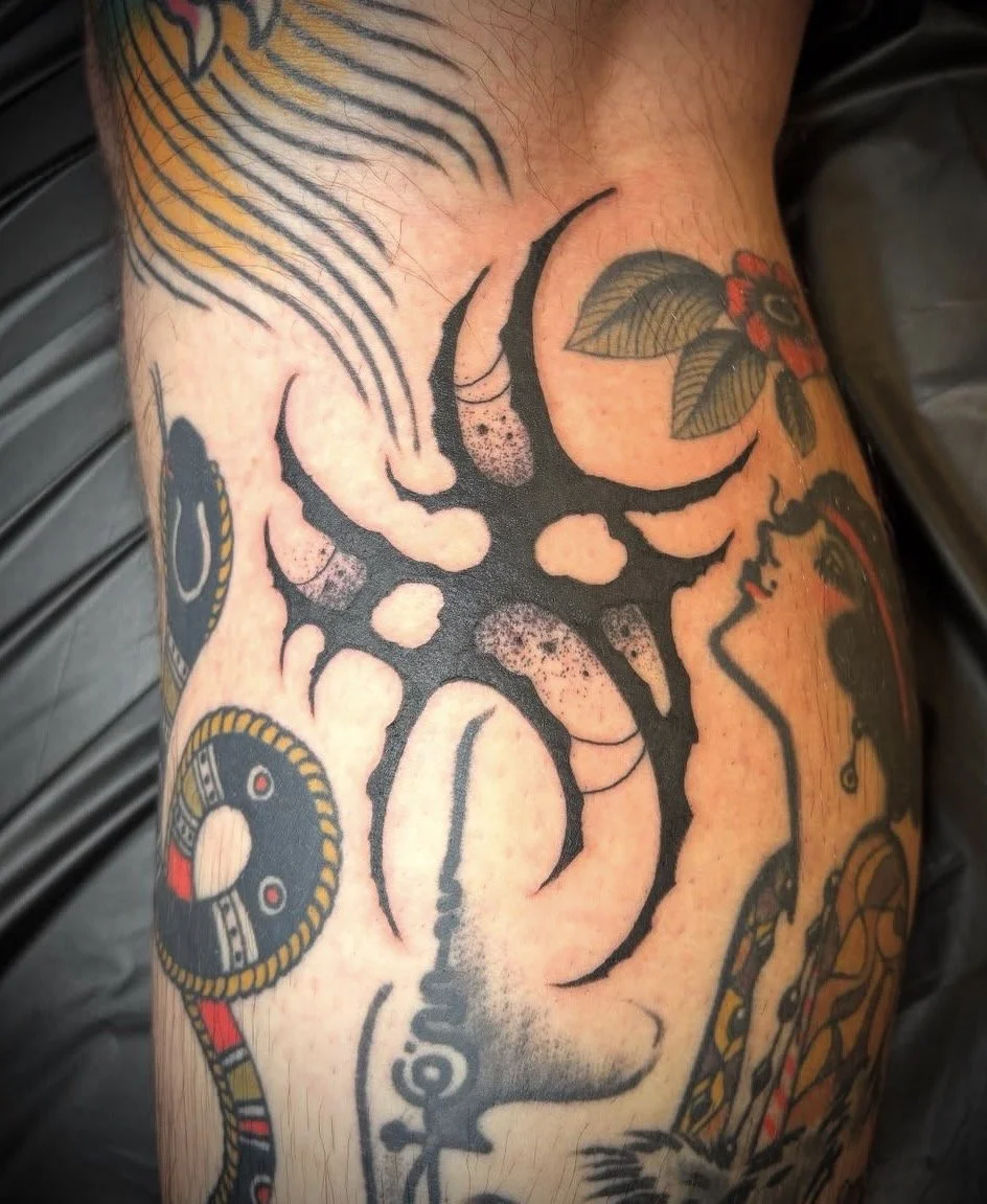 Kyle Grand @kylexgrand black work Sigilism tattoo on the leg done at Dame of the West Tattoo in Scottsdale, Arizona.jpeg