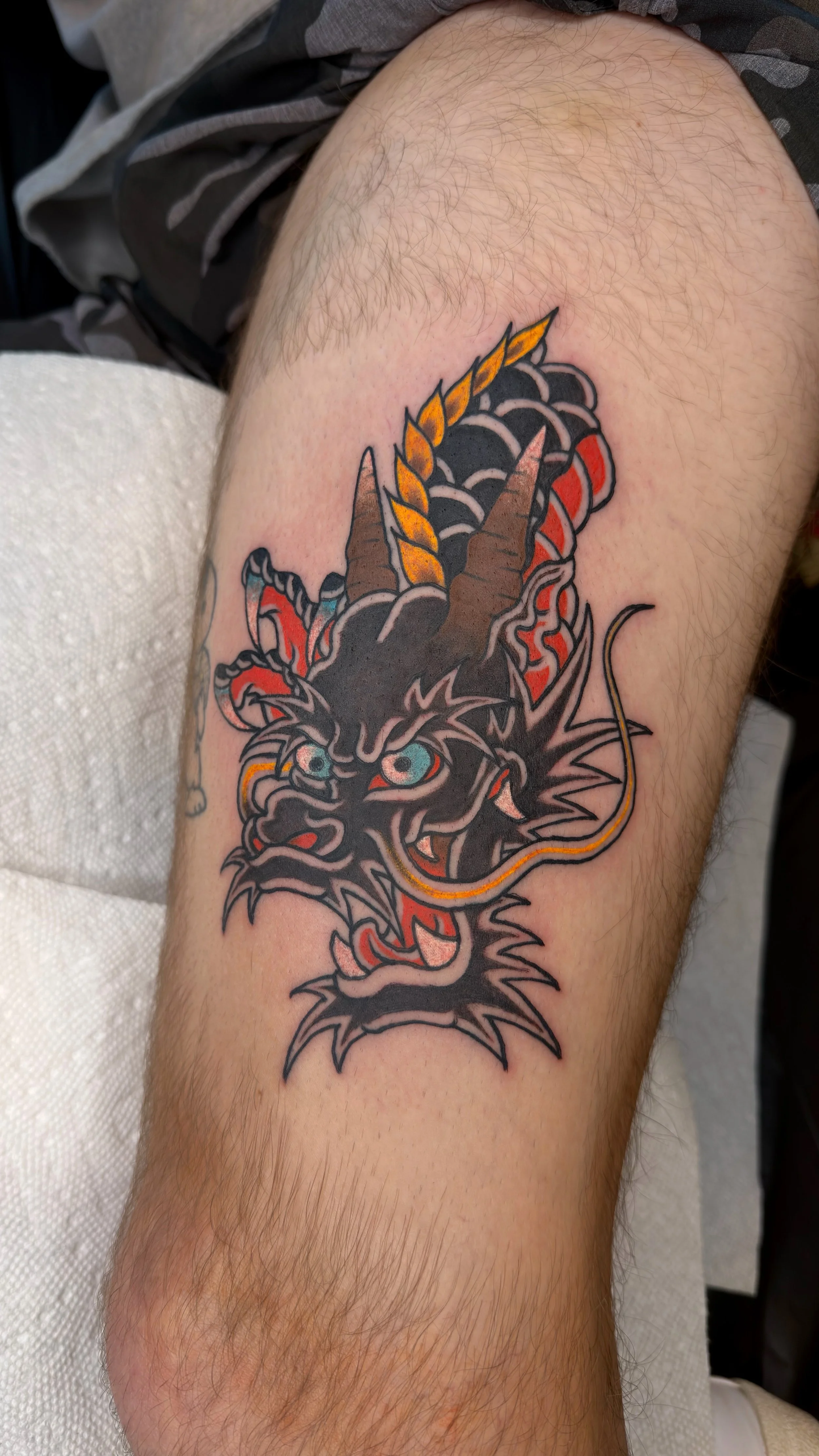 Landon Eck Traditional Japanese Dragon Head Tattoo on the arm at Dame of the West Tattoo in Scottsdale, Arizona
