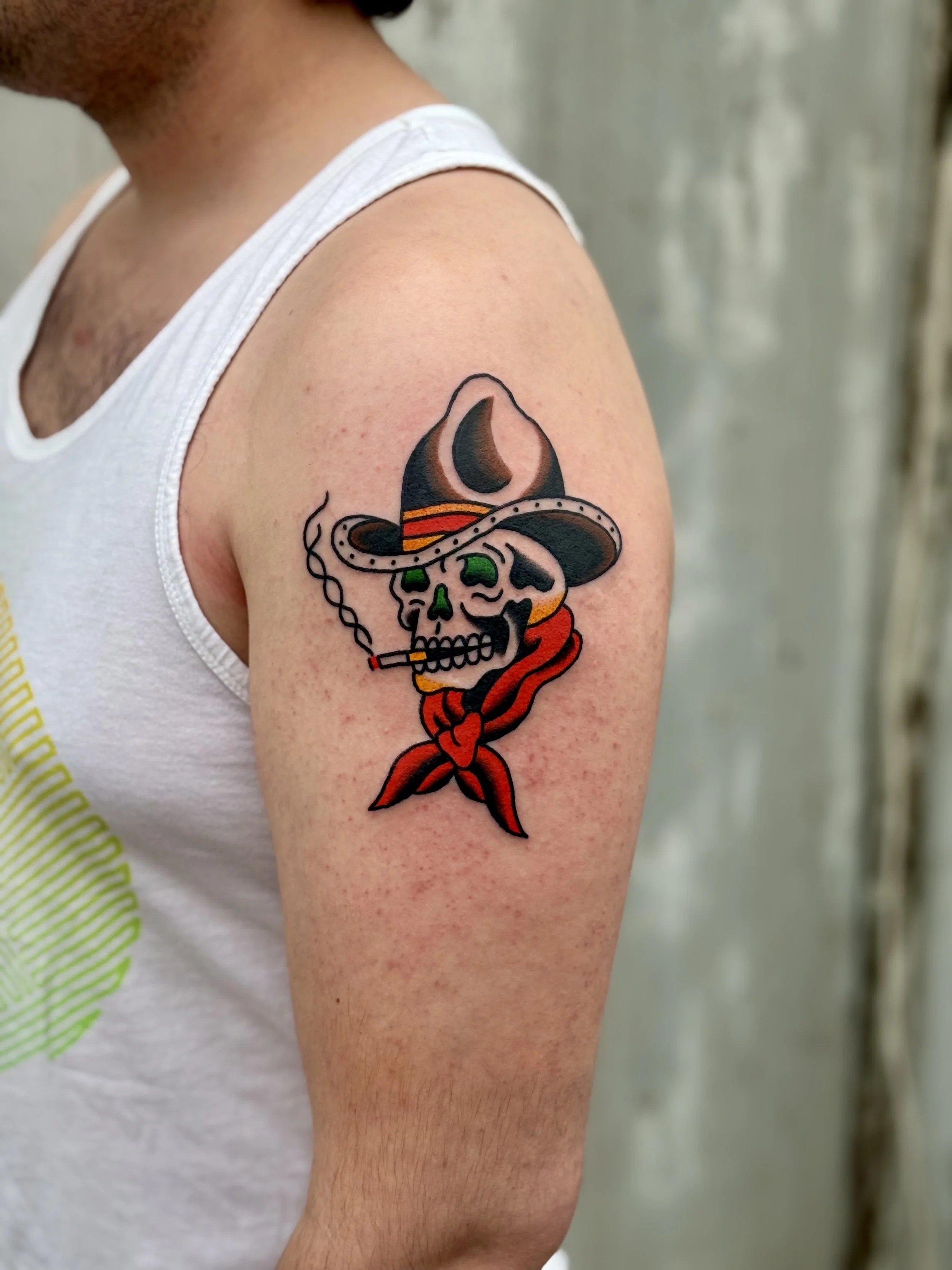 Jonas Richards, @jonasrichardstattoo American Traditional Cowboy Skull Tattoo on the upper arm done at Dame of the West Tattoo in Scottsdale, Arizona.