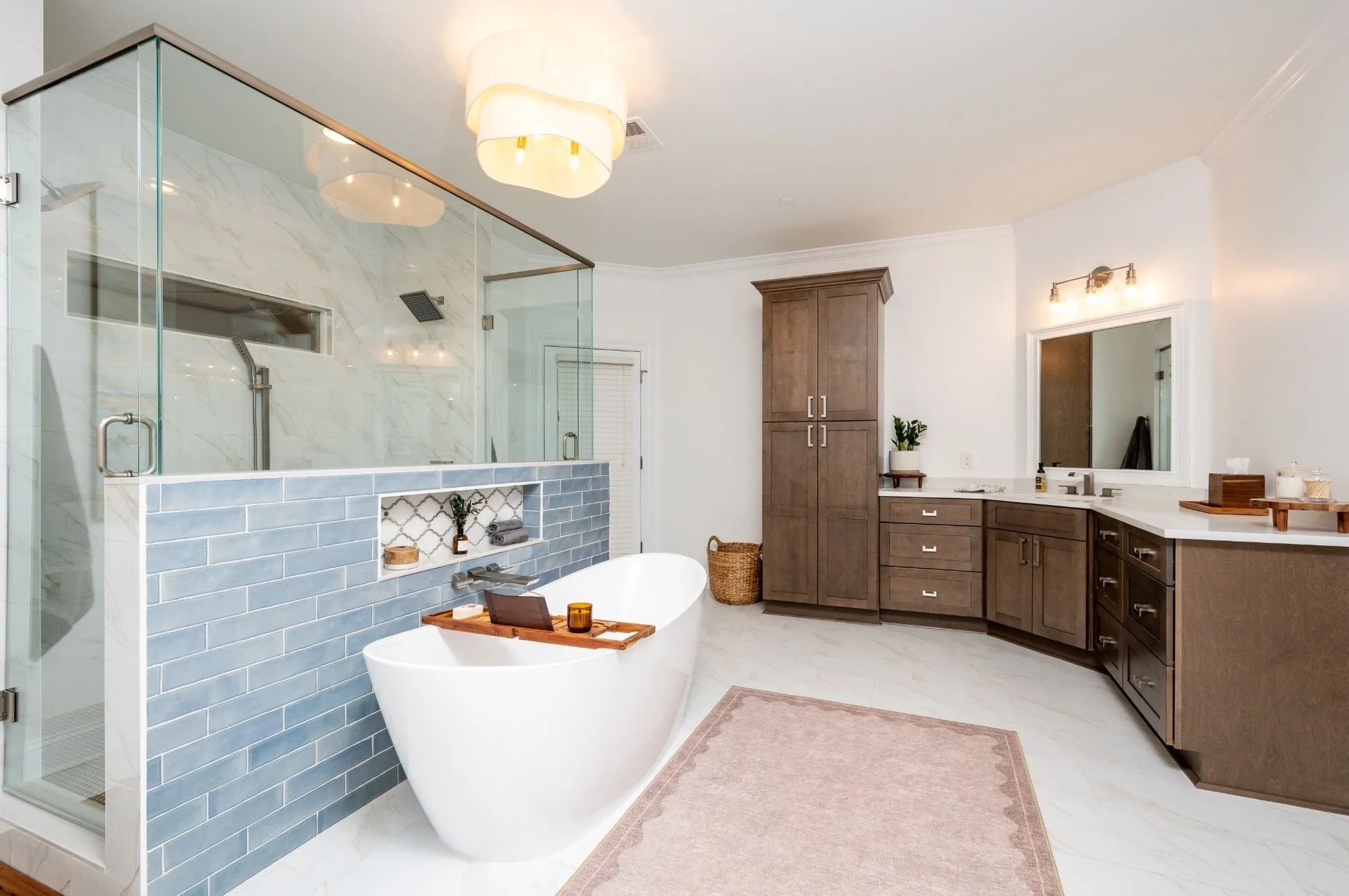 Germantown primary bathroom remodel with a freestanding tub, glass walk-in shower and custom wood cabinetry