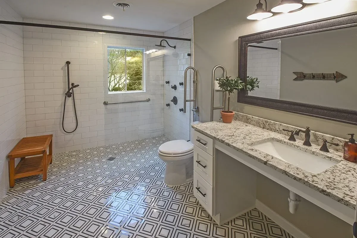 Accessible Germantown bathroom remodel with a spacious walk-in shower, handheld showerhead, grab bars and patterned flooring.