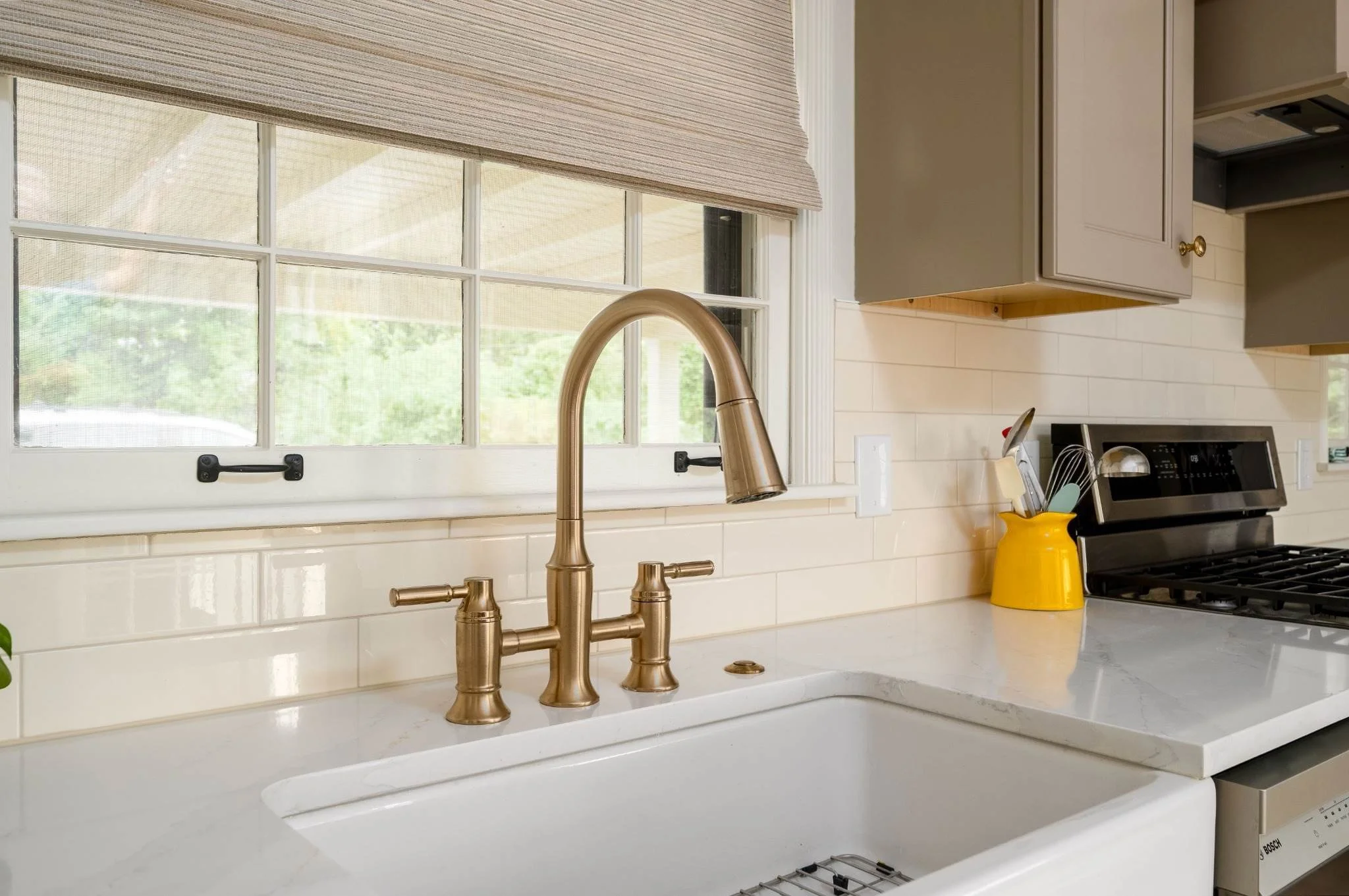 Taupe Kitchen with Farmhouse Sink and Range