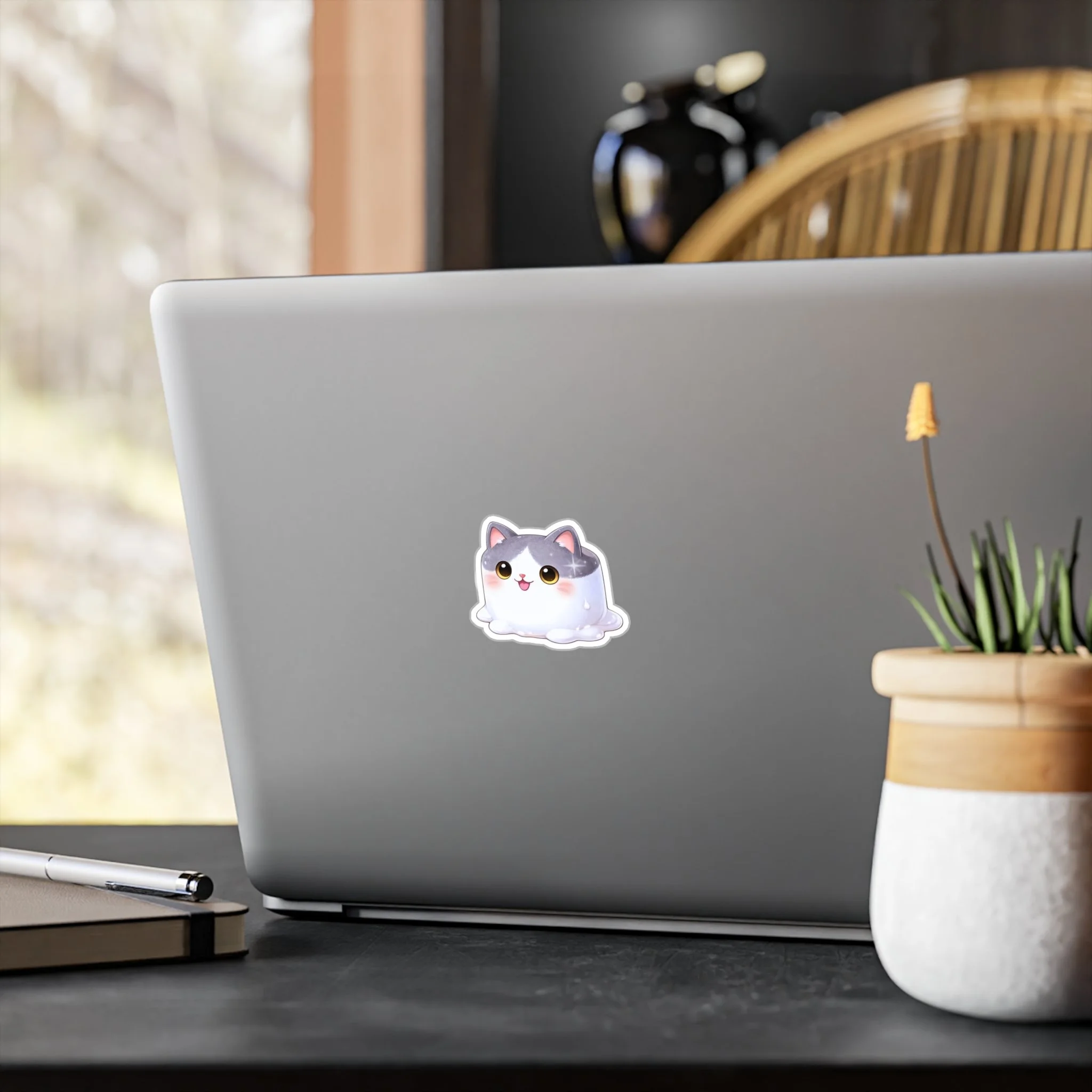 MMM Vinyl Cut Sticker on laptop.png