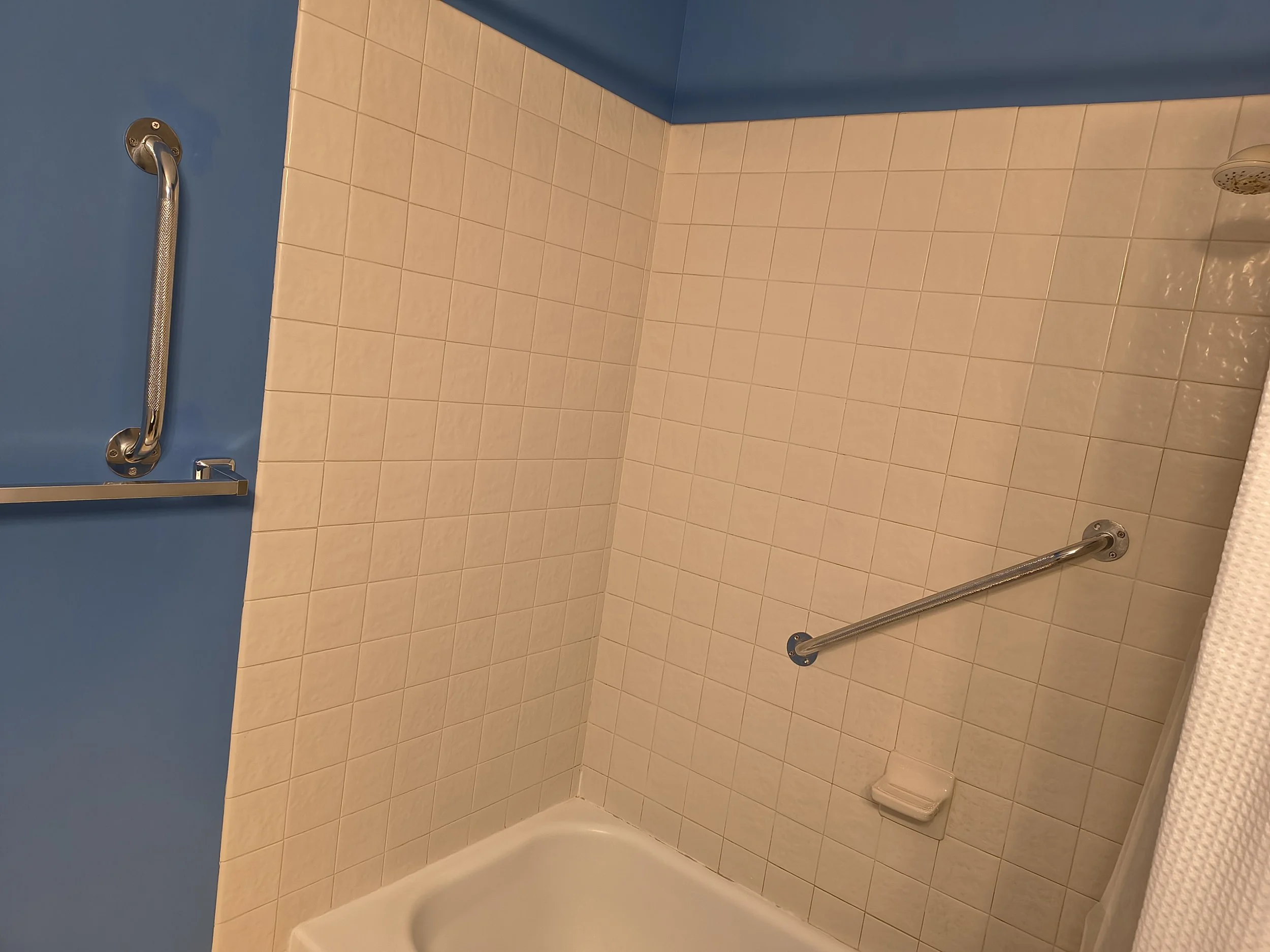 Install grab bars in drywall, tile, or fiberglass shower walls