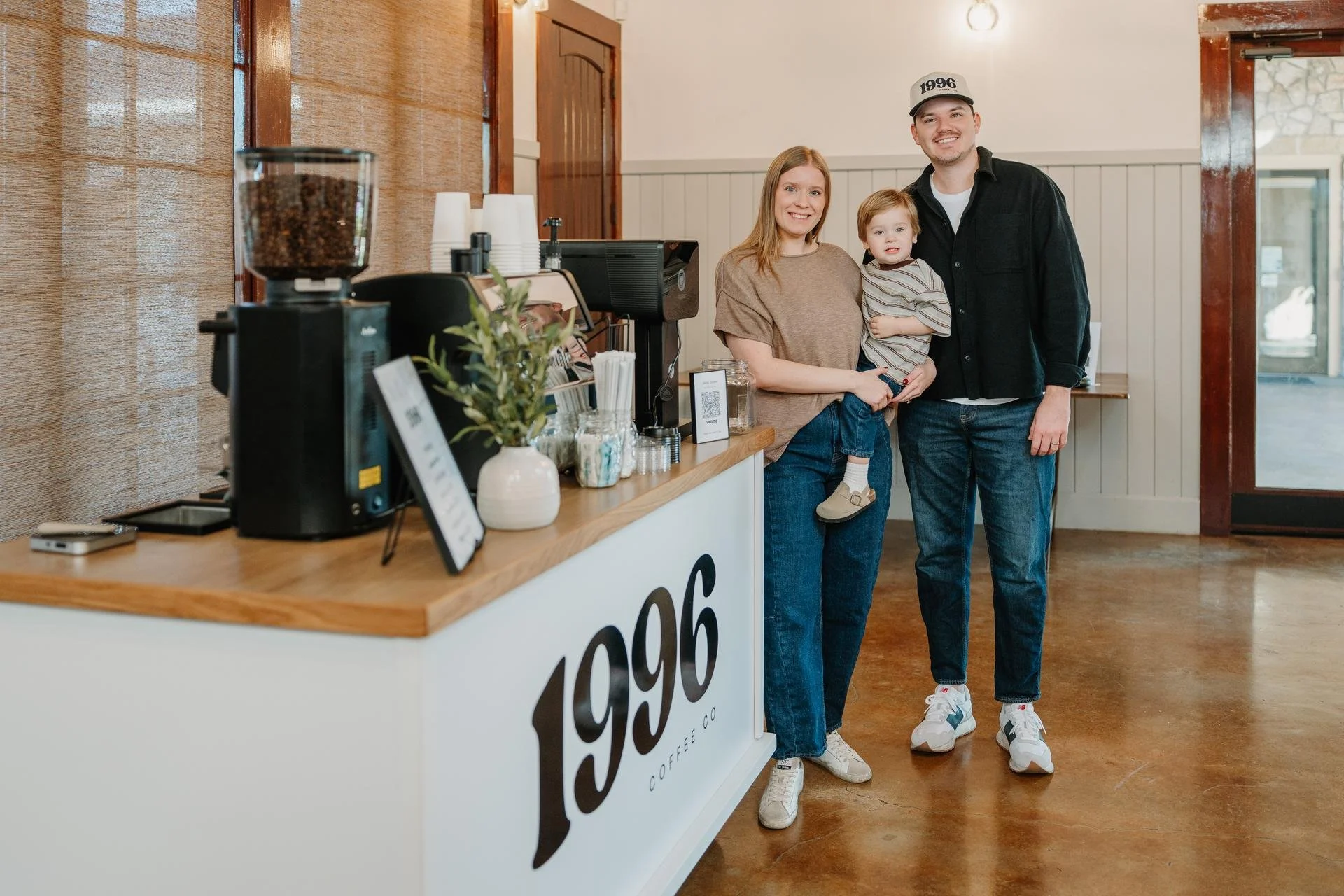 The founders of 1996 coffee cart standing next to their mobile set up