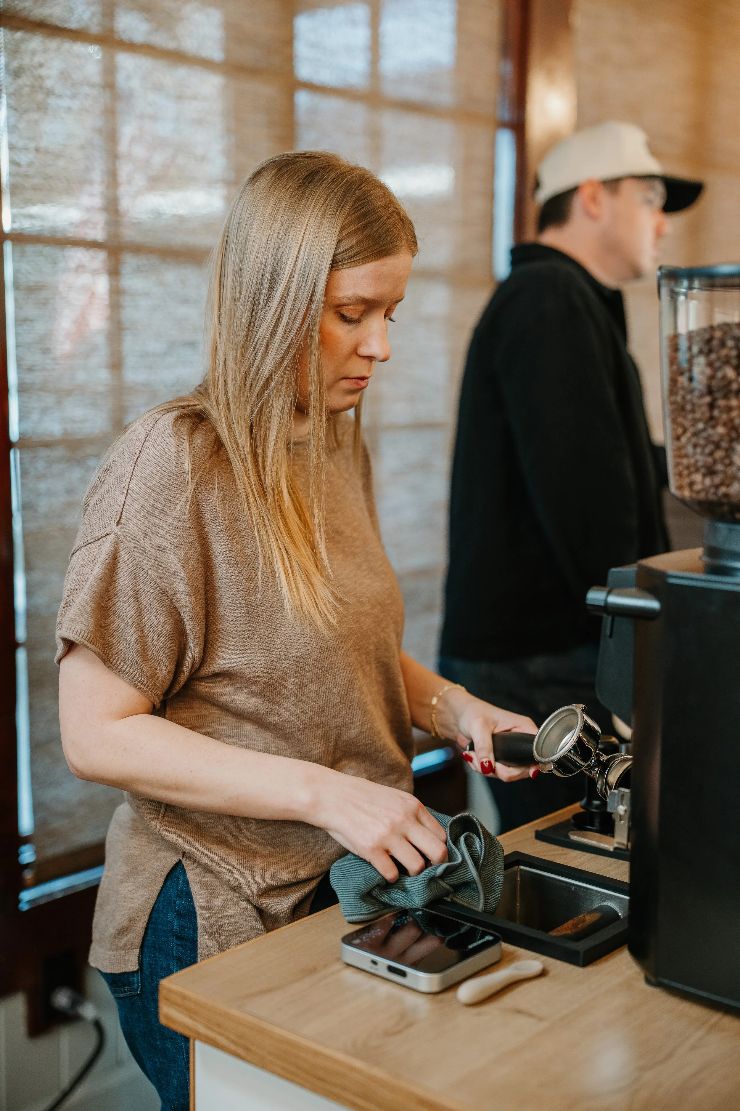 Woman barista working behind coffee cart in Kyle