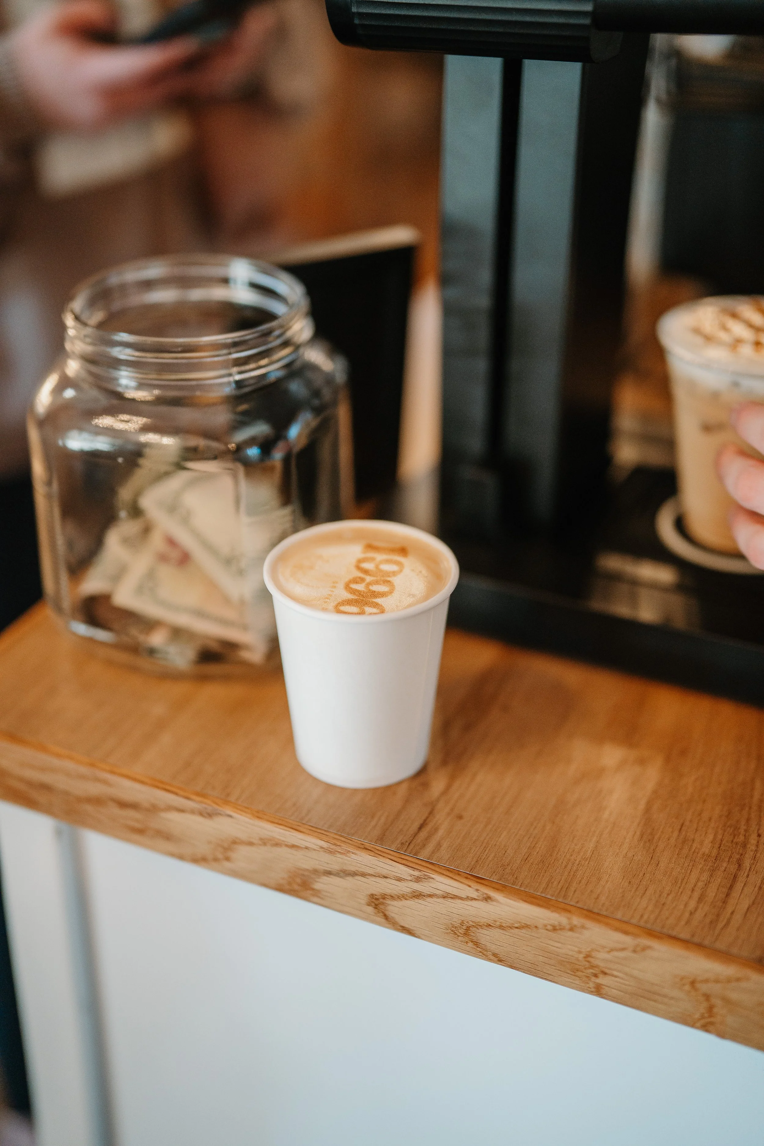 latte sitting on counter branded with 196 coffee co