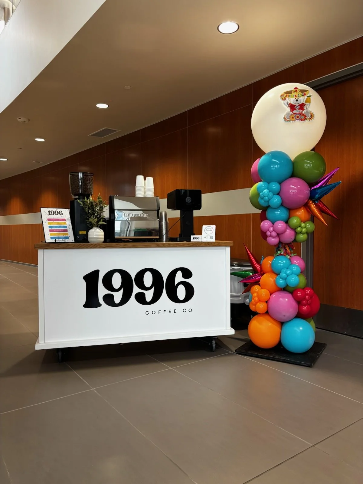 sleek coffee cart set up with fiesta colors for coffee catering event