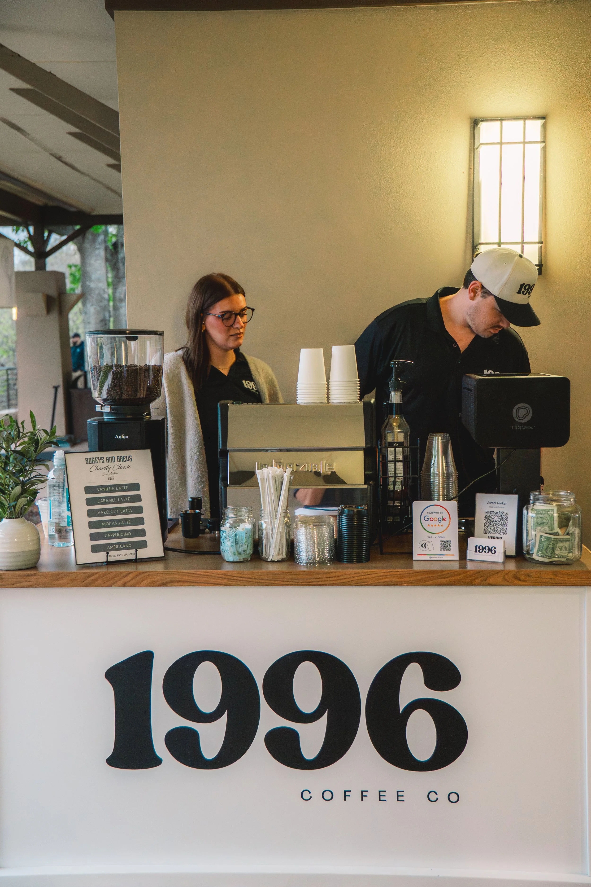 Mobile espresso bar coffee cart catering in San Antonio with professional baristas serving lattes and cappuccinos for weddings, corporate events, and brand activations.