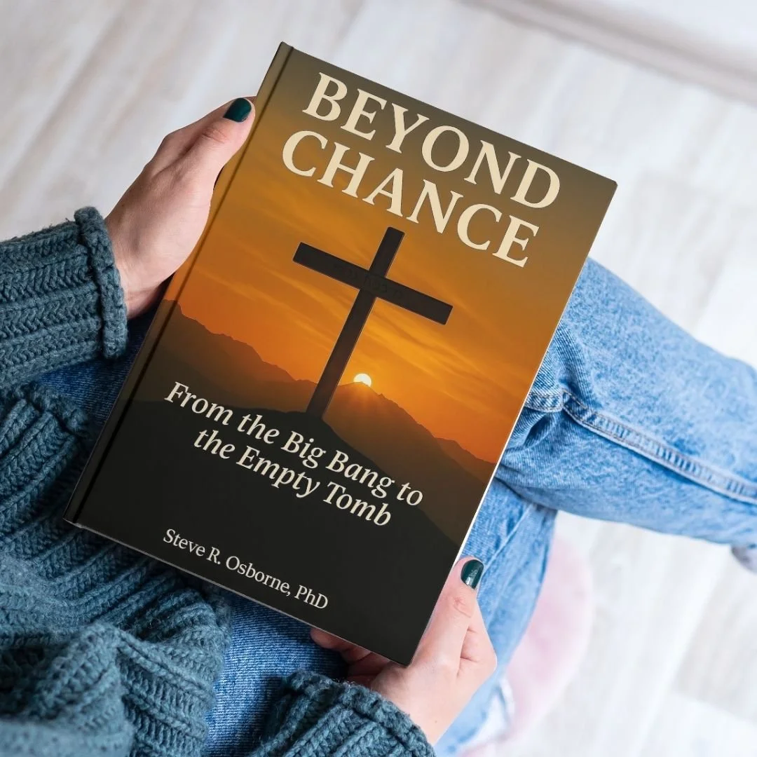 A person wearing a knitted sweater and jeans is holding a book titled 'Beyond Chance: From the Big Bang to the Empty Tomb' by Steve R. Osborne, PhD. The book cover features a sunset with a cross silhouette.