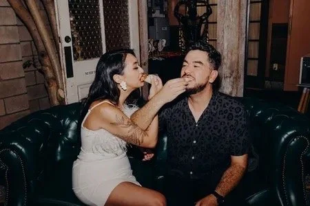 wedding couple enjoying Olive Wood Pizza wood-fired catering