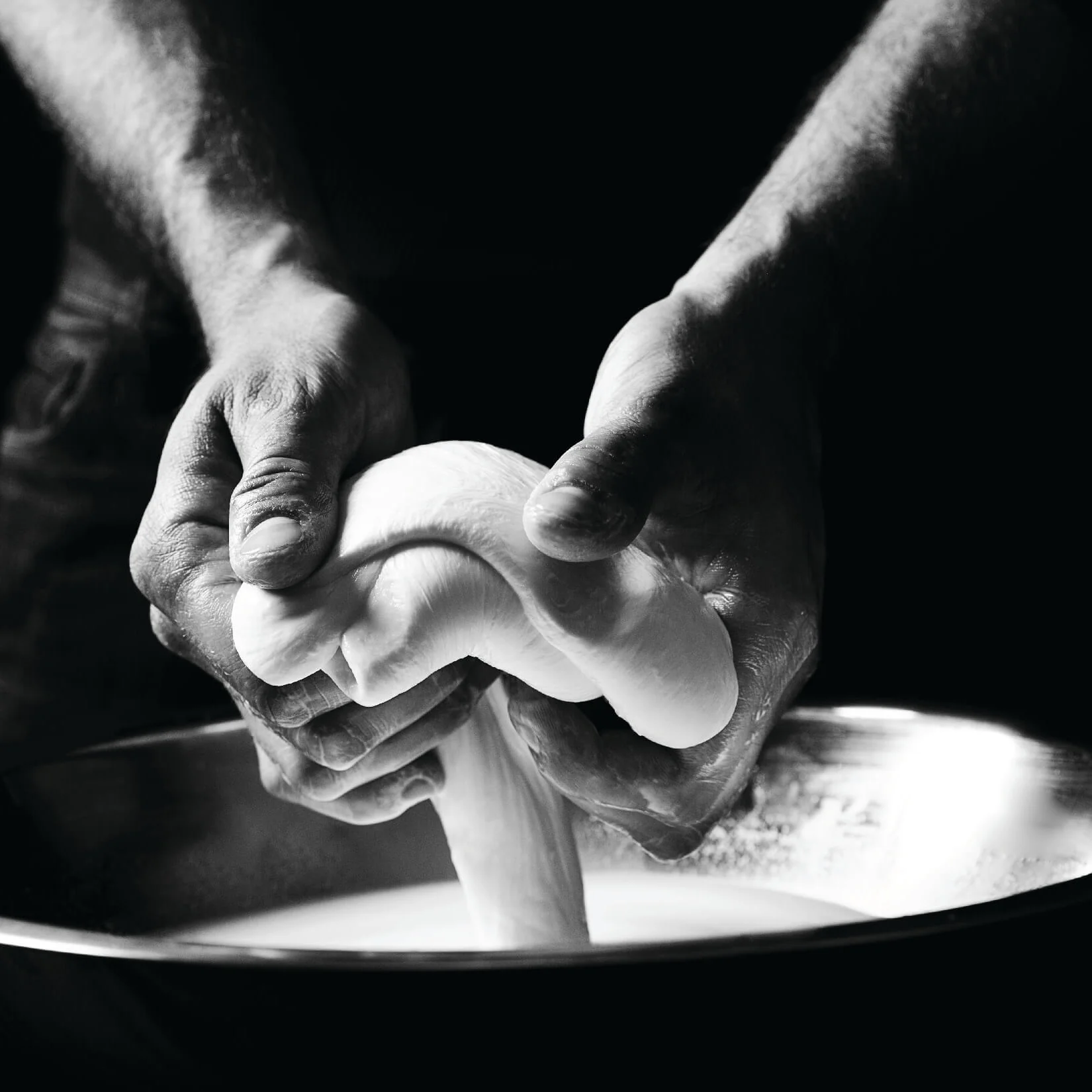 di Stefano master cheesemaker making fresh mozzarella for Olive Wood Pizza