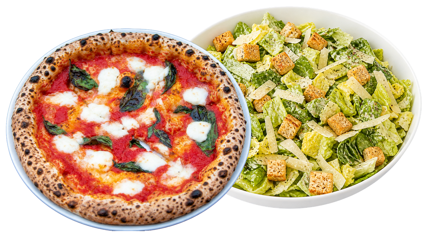 A Margherita pizza with crushed tomato, mozzarella, and basil next to a bowl of Caesar salad with romaine lettuce, croutons, and shaved Parmesan cheese.