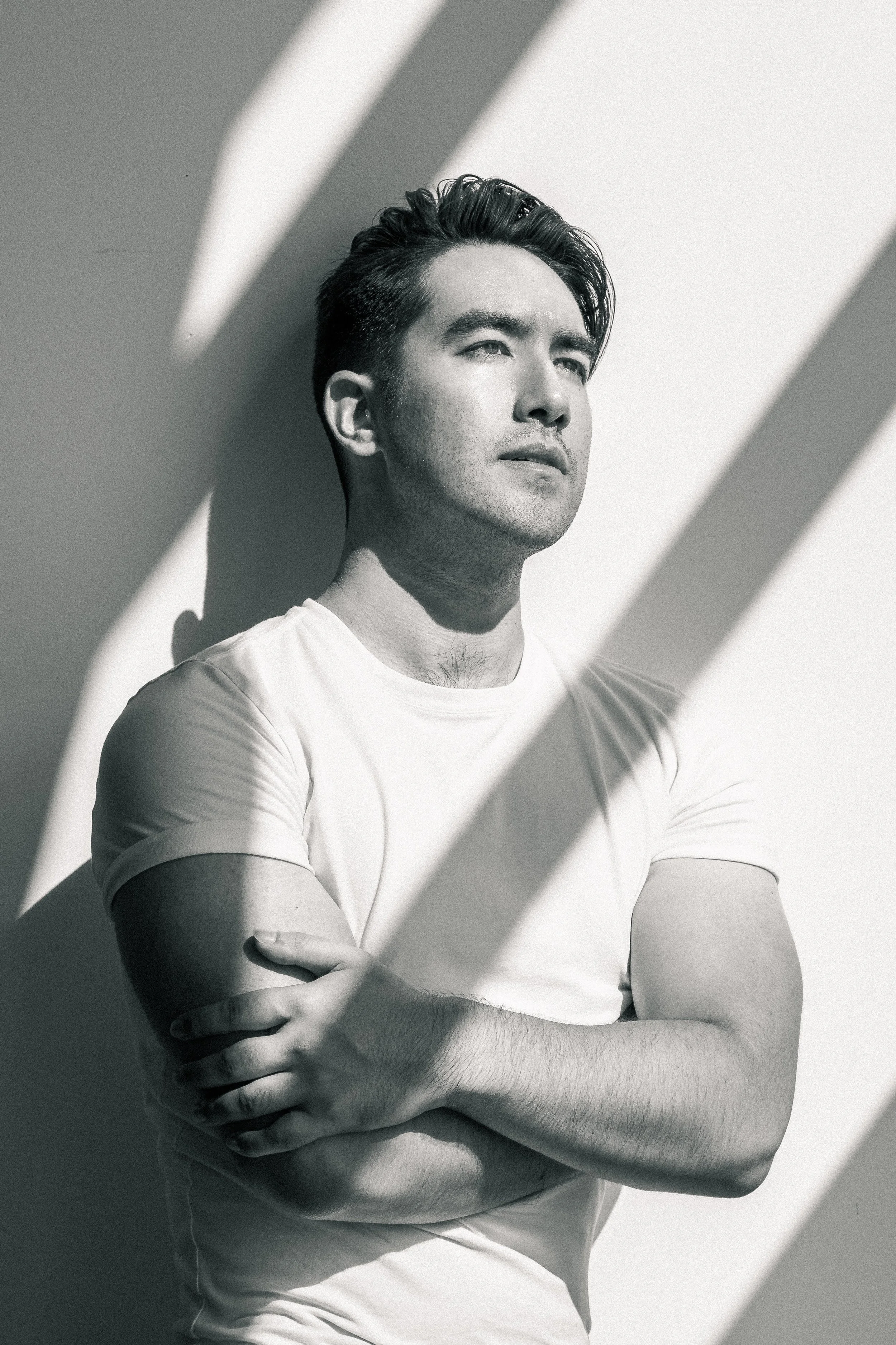 Taylor Hurst Los Angeles commercial model featured in a men’s magazine photoshoot by Alex Tupaz Photography, wearing a white t-shirt, demonstrating professional modeling skills, fashion versatility, and editorial/commercial appeal.