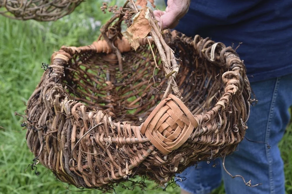 a ribbed basket made with wild harvested vines and bark