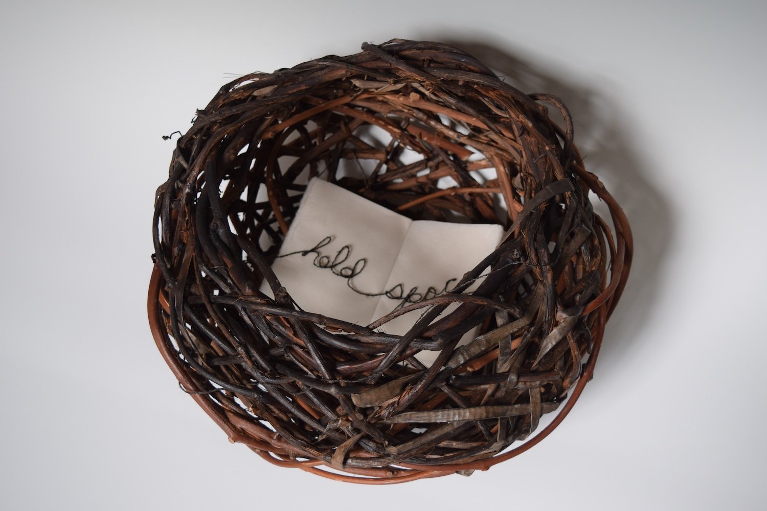 Hold Space; grapevine, tulip tree inner bark, acorn ink, basswood cordage, Japanese paper; 16" x 16" x 10"
